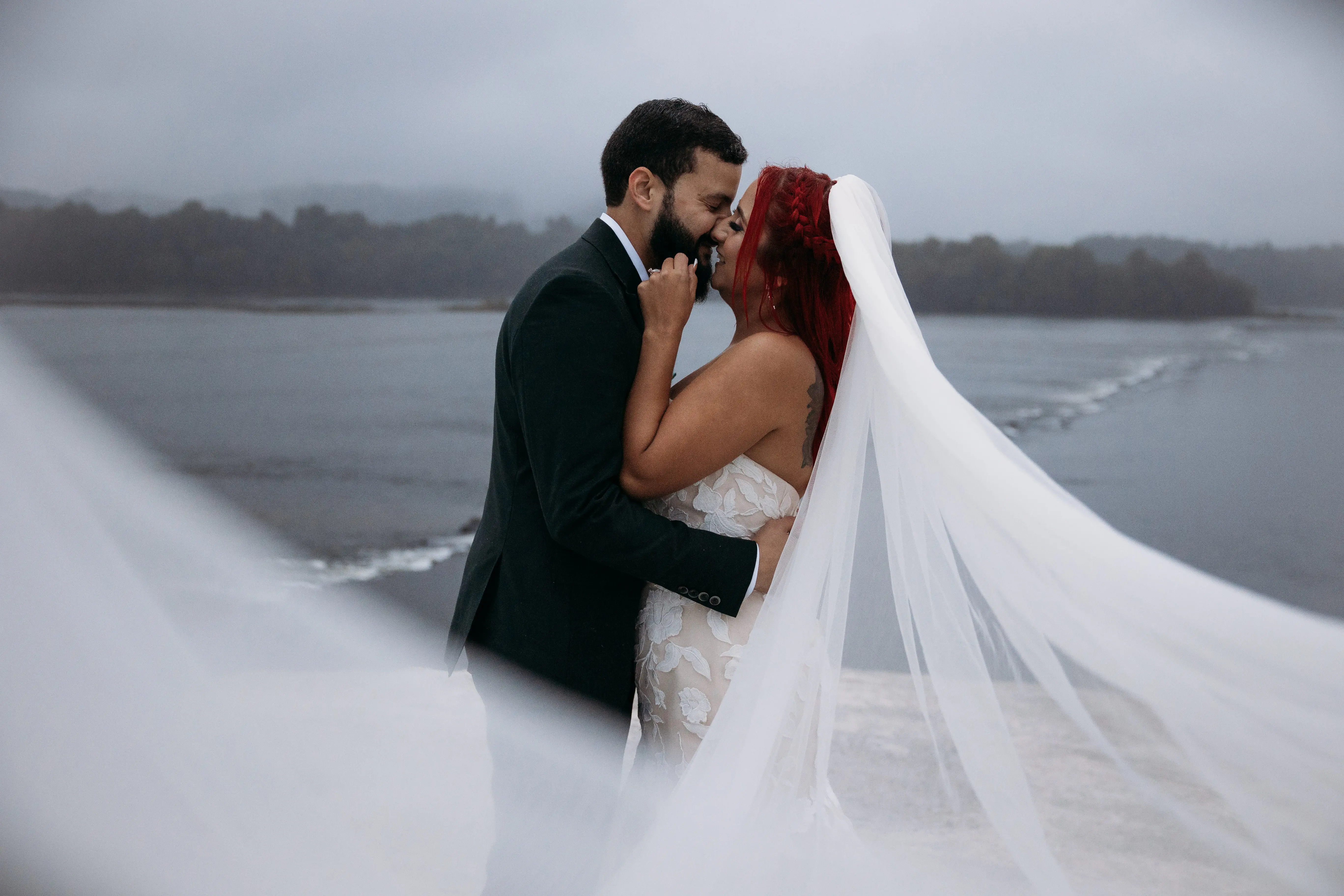 Groom On The Beach With Bride In White Dress Named Hattie By Rebecca Ingram