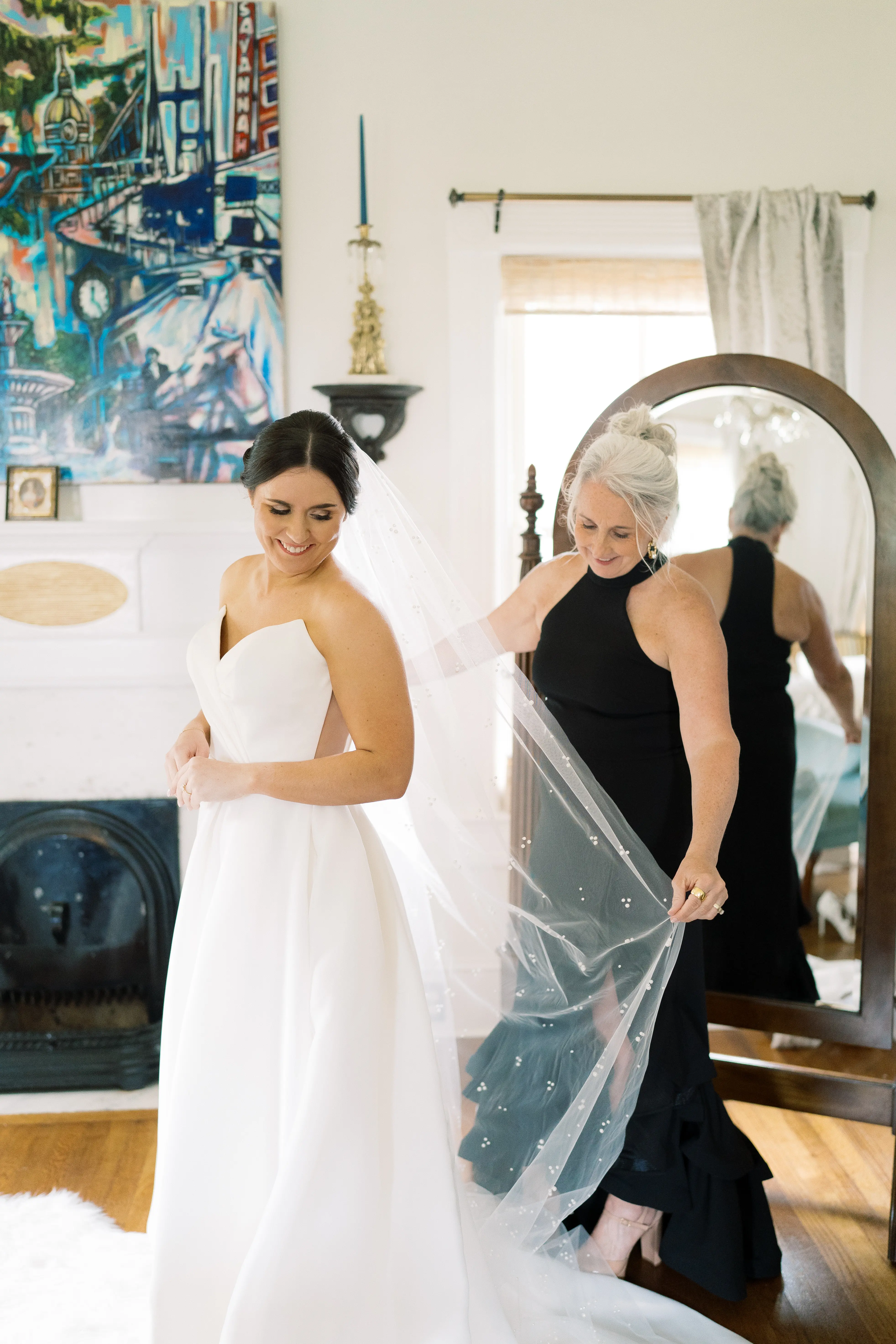 Bride wearing Nisha by Maggie Sottero having her veil fluffed