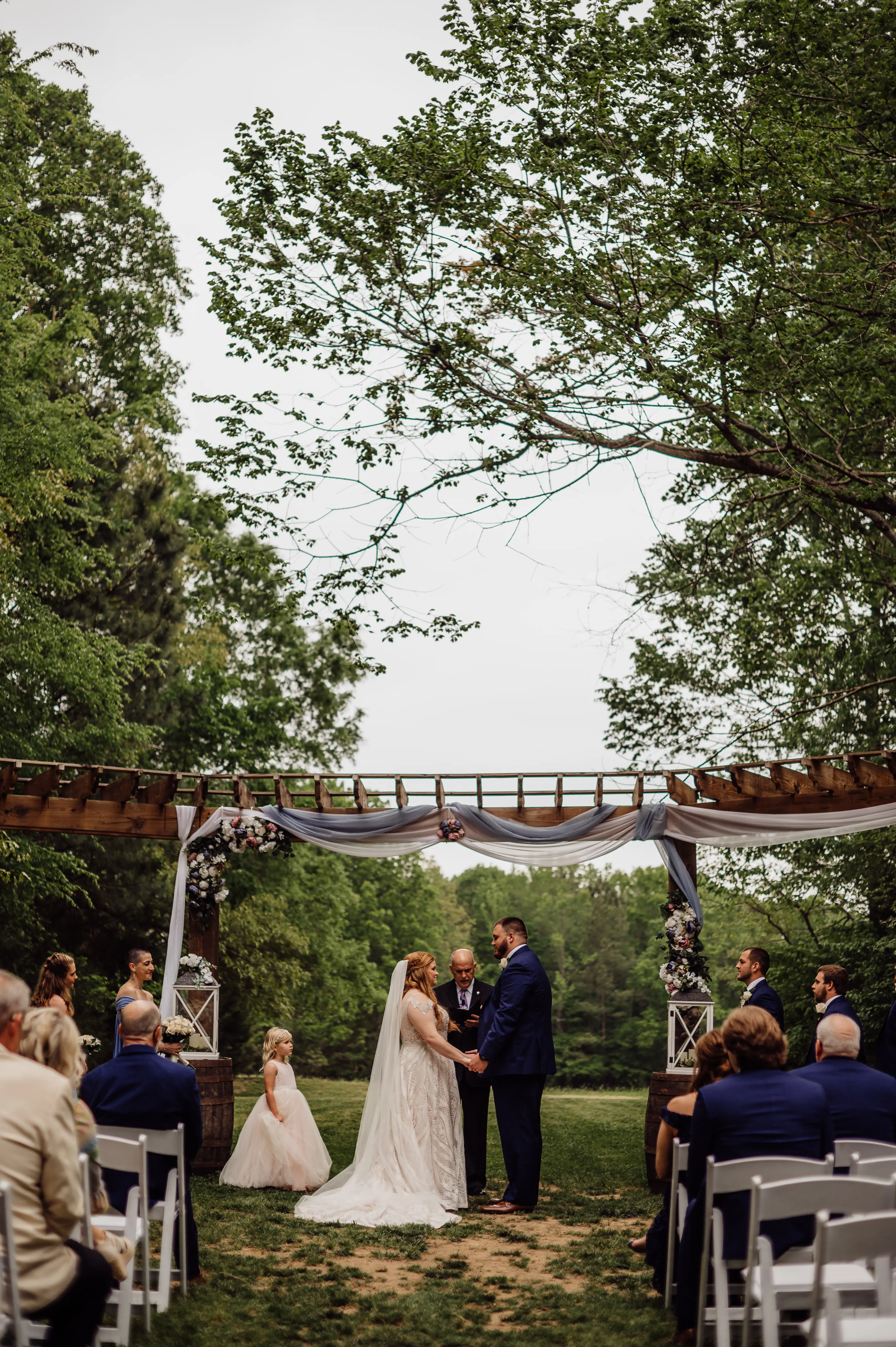 Groom at Altar with Bride in A-Line Wedding Dress with Allover Sequin Lace Called Roxanne by Sottero & Midgley