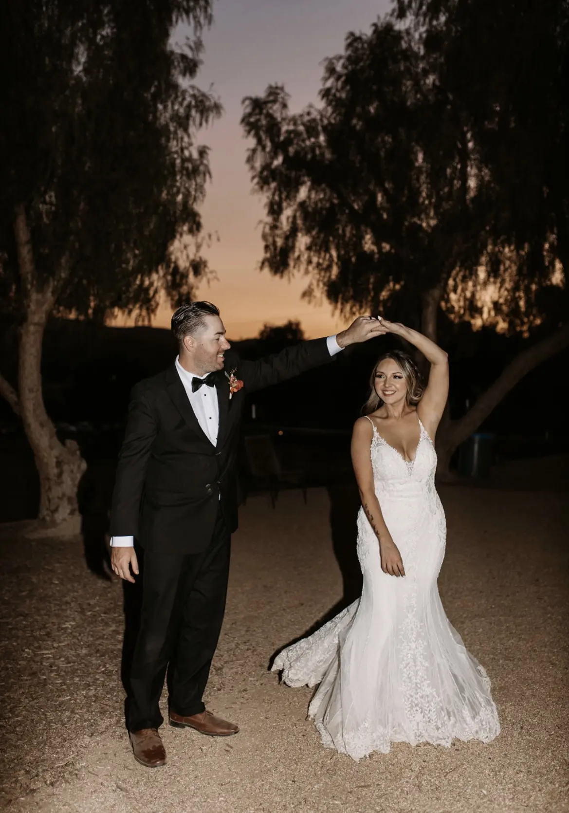 Bride In Beaded Fit-And-Flare Wedding Dress Called Barrett By Sottero And Midgley With Groom