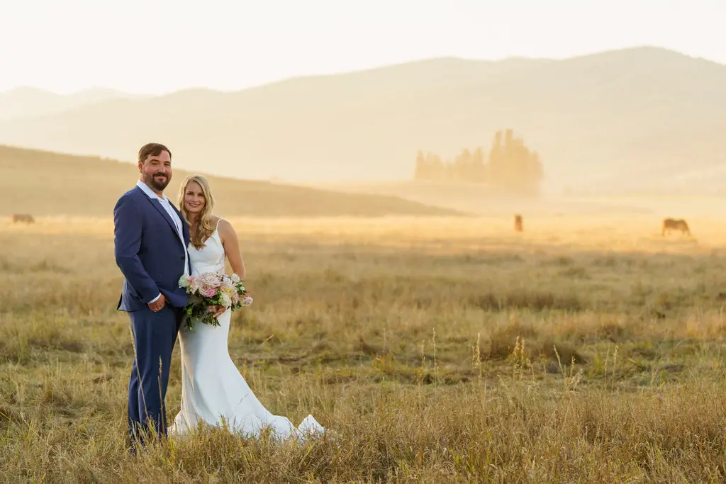 Bride wearing Dionne wedding dress by Rebecca Ingram with her husband