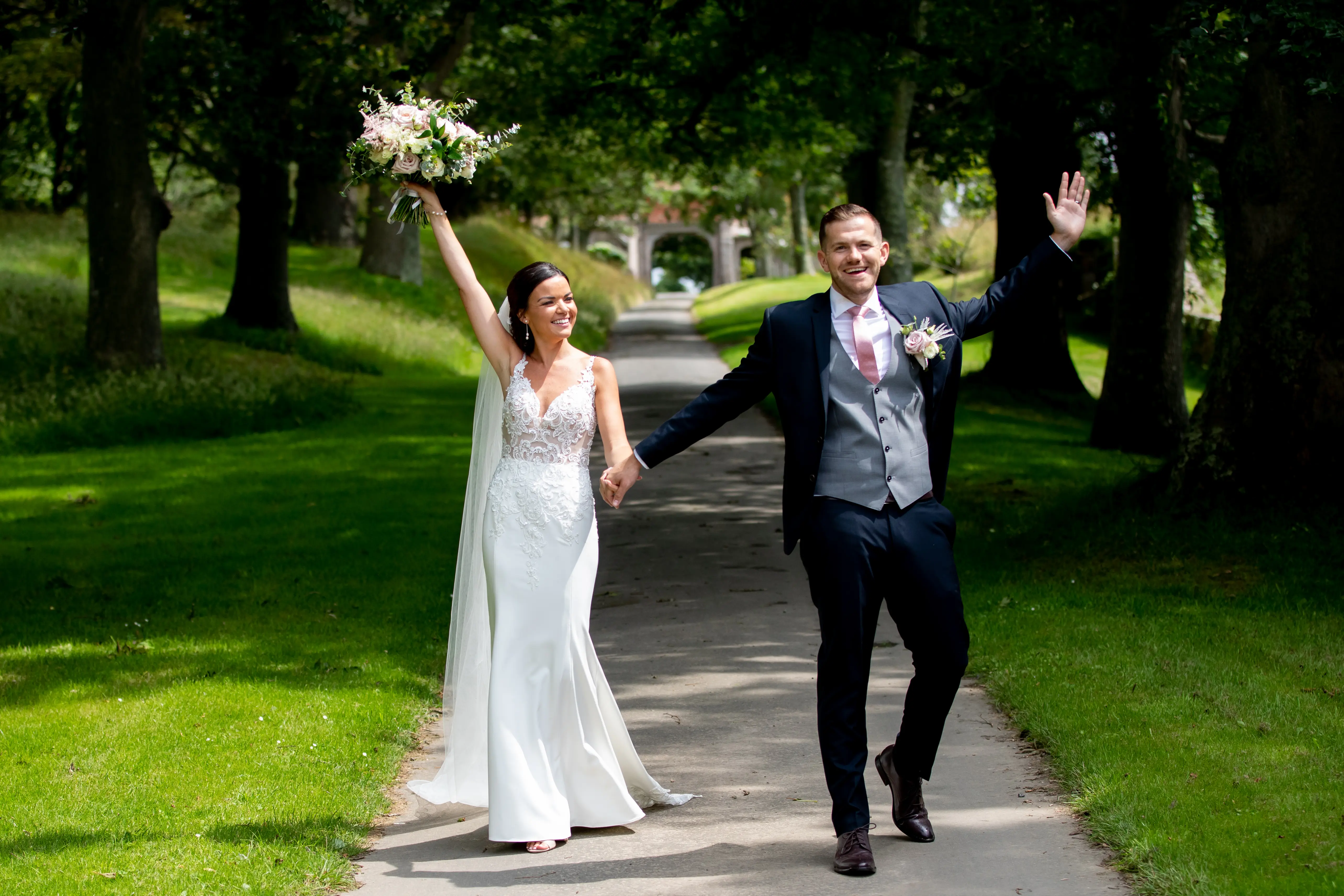 Bride with groom wearing crepe sheath wedding dress
