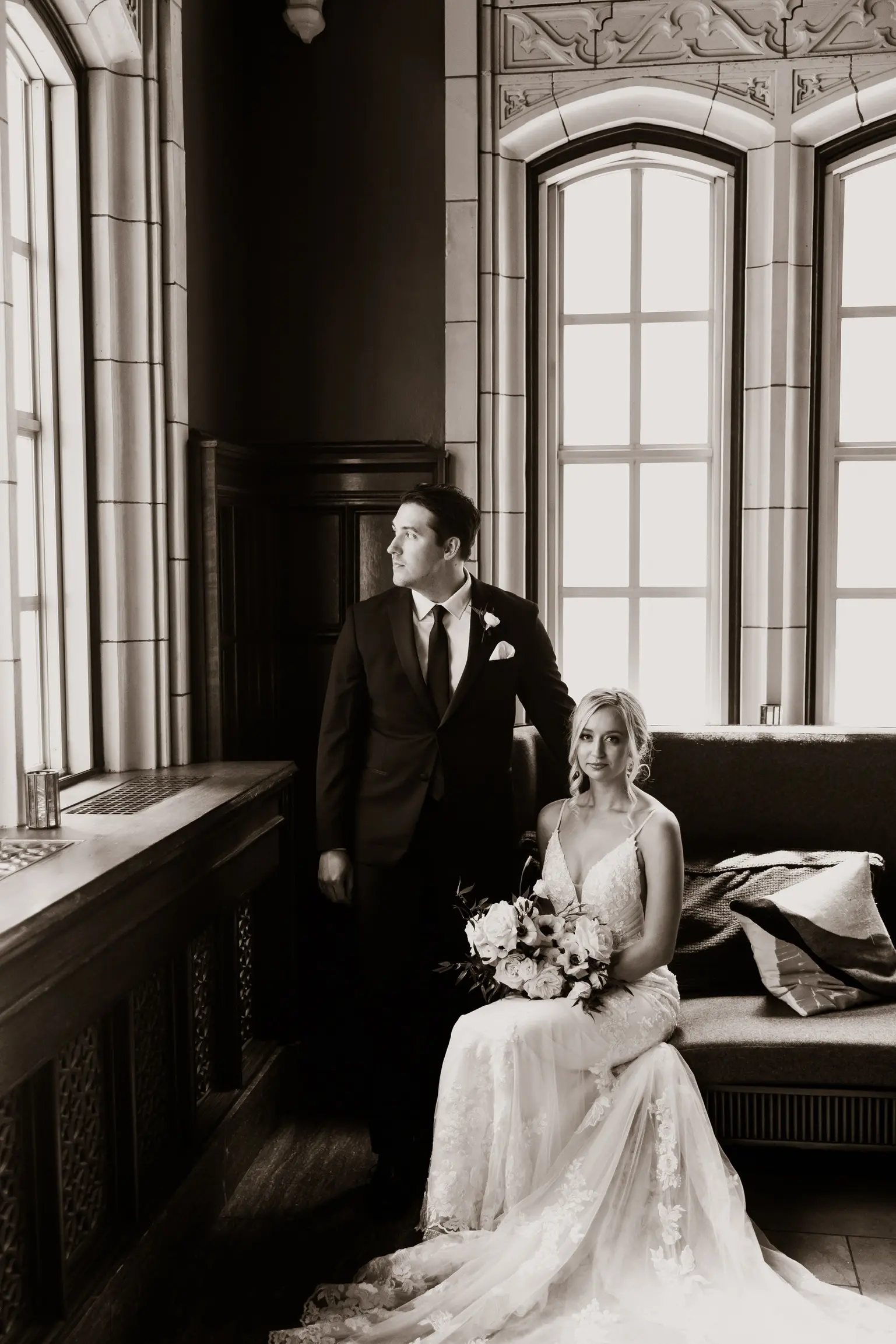 Bride Wearing Sparkle Lace Long Train Wedding Dress Called Fontaine By Maggie Sottero Sitting Next To Groom By Long Windows