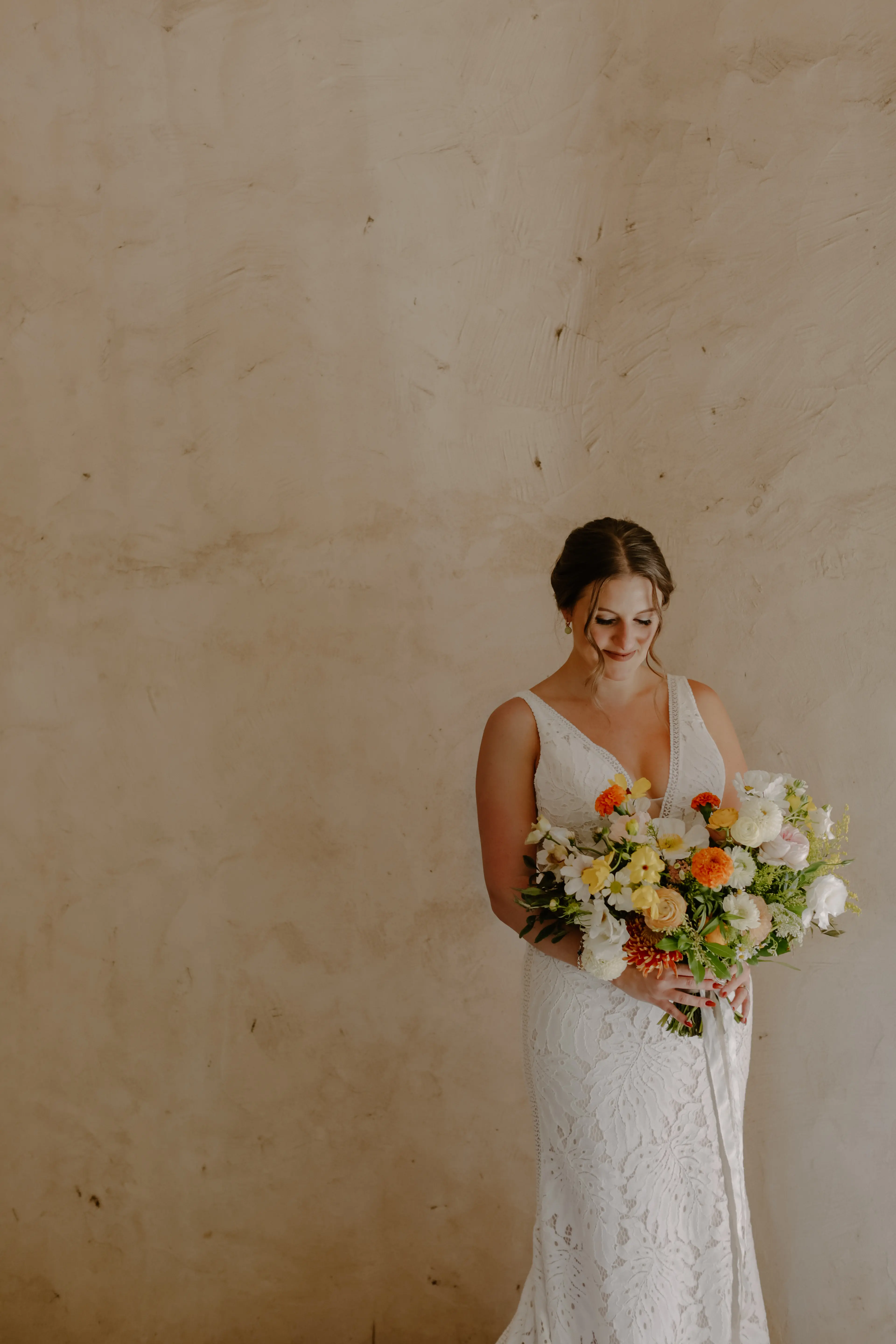 Bride wearing sexy boho lace wedding dress.