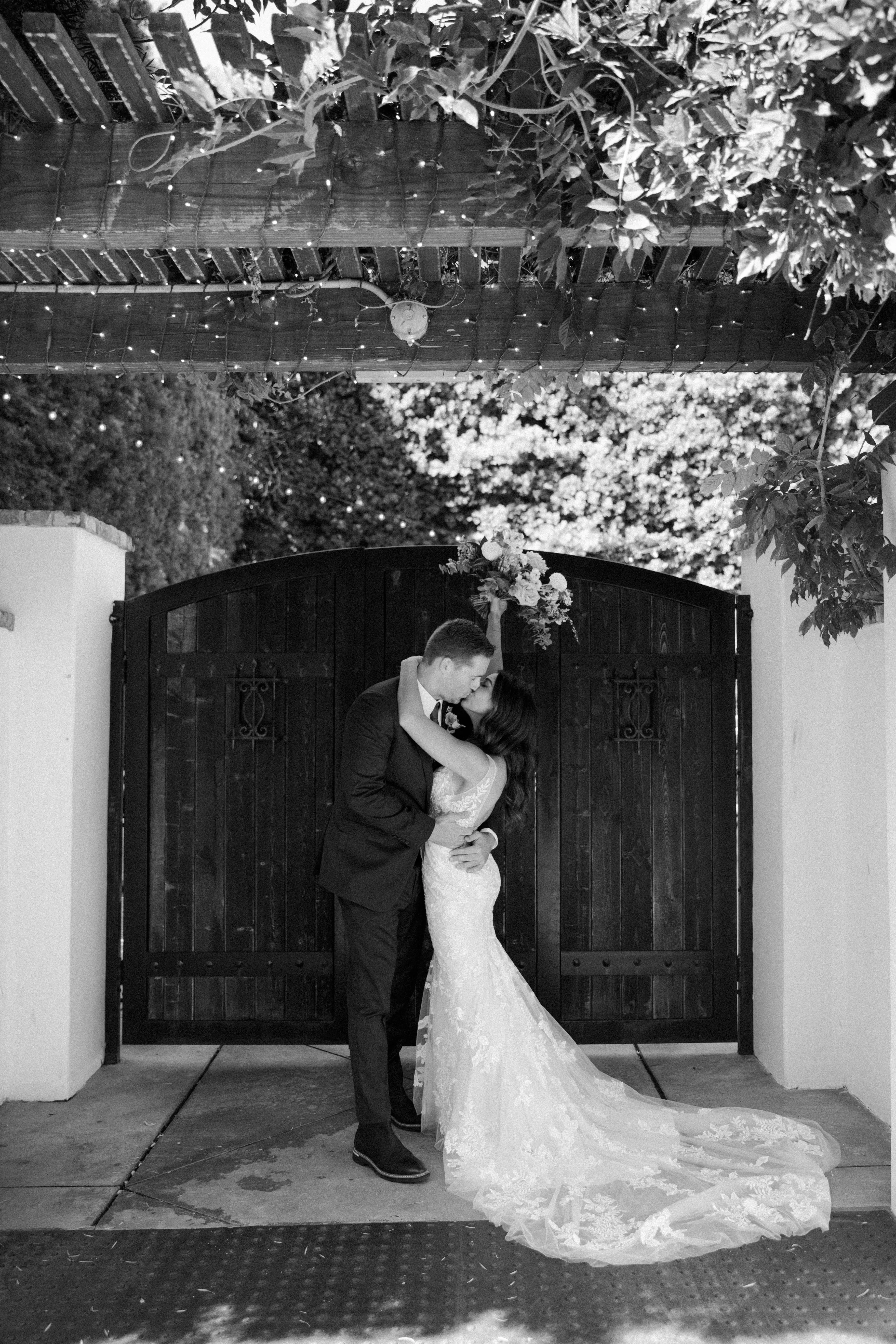 Bride with groom wearing floral fit and flare wedding dress