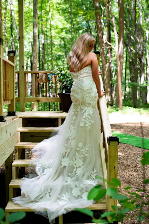 Bride Wearing Lace Strapless Mermaid Wedding Dress Called Hattie By Rebecca Ingram Back In Woods