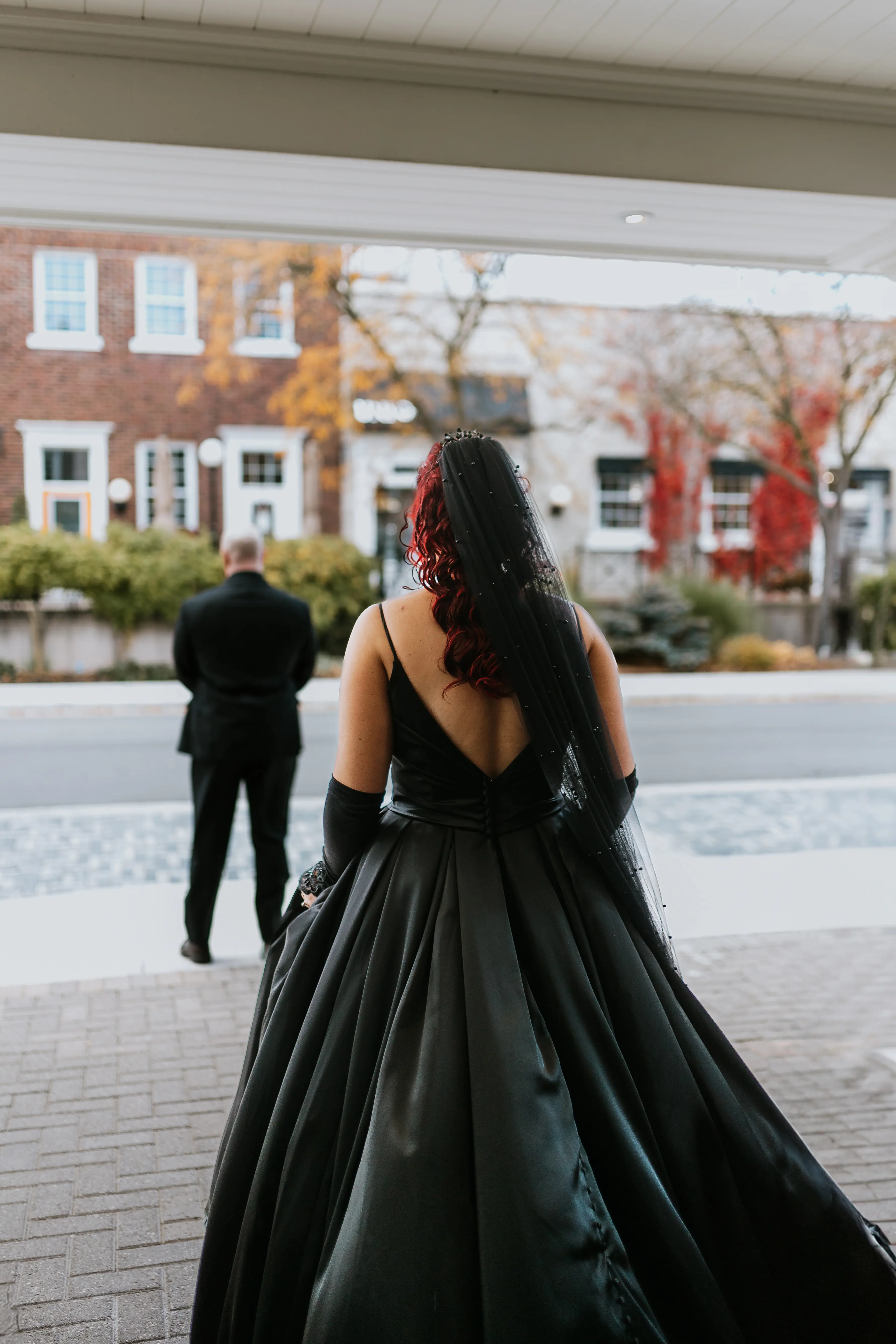 Bride Wearing Black Aline Wedding Dress Called Scarlet By Maggie Sottero Doing A First Look With Groom