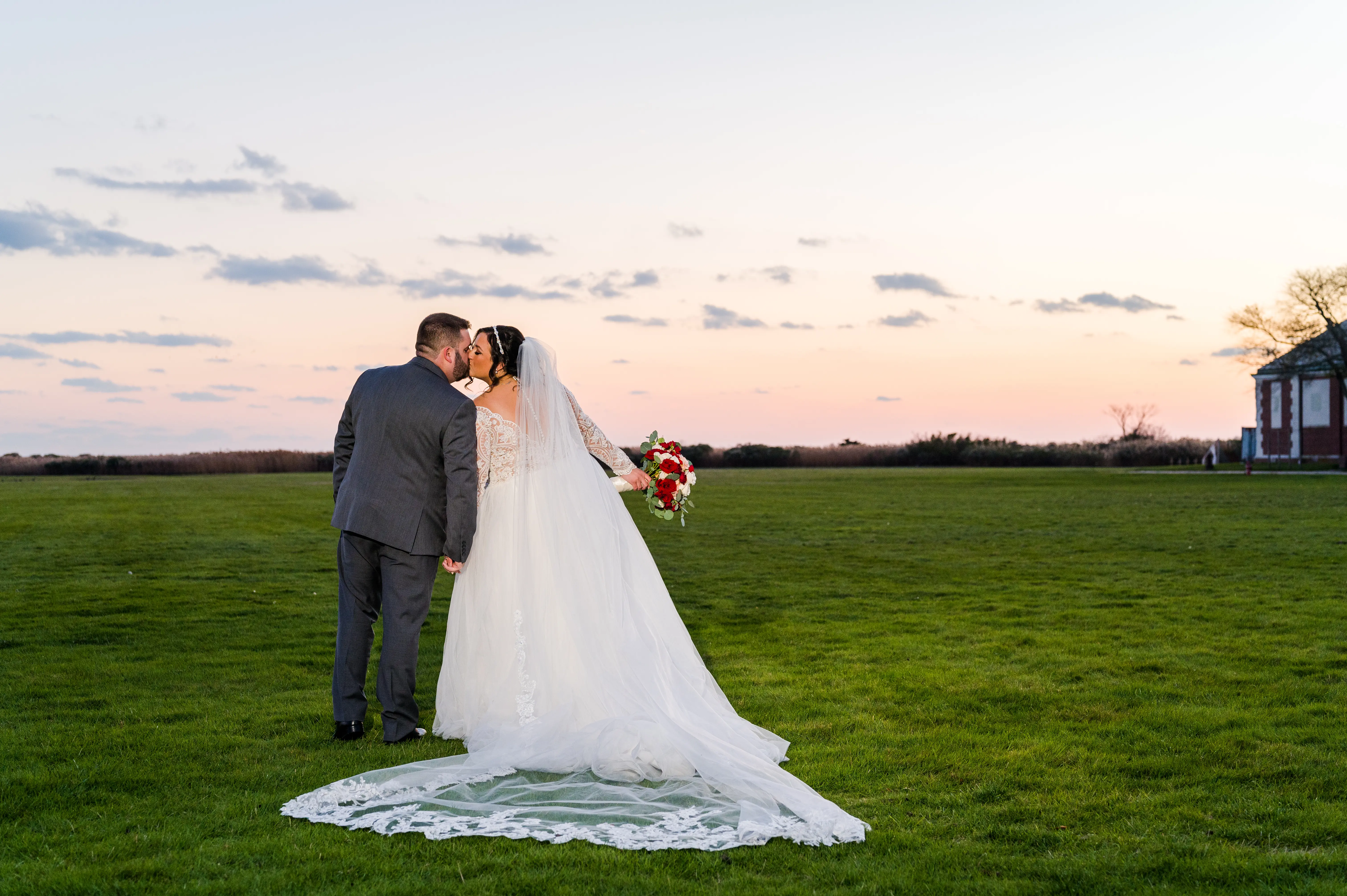 Bride And Groom Together. Bride Wearing Long Sleeve Lace Ball Gown With Tulle Skirt Called Mallory Dawn By Maggie Sottero