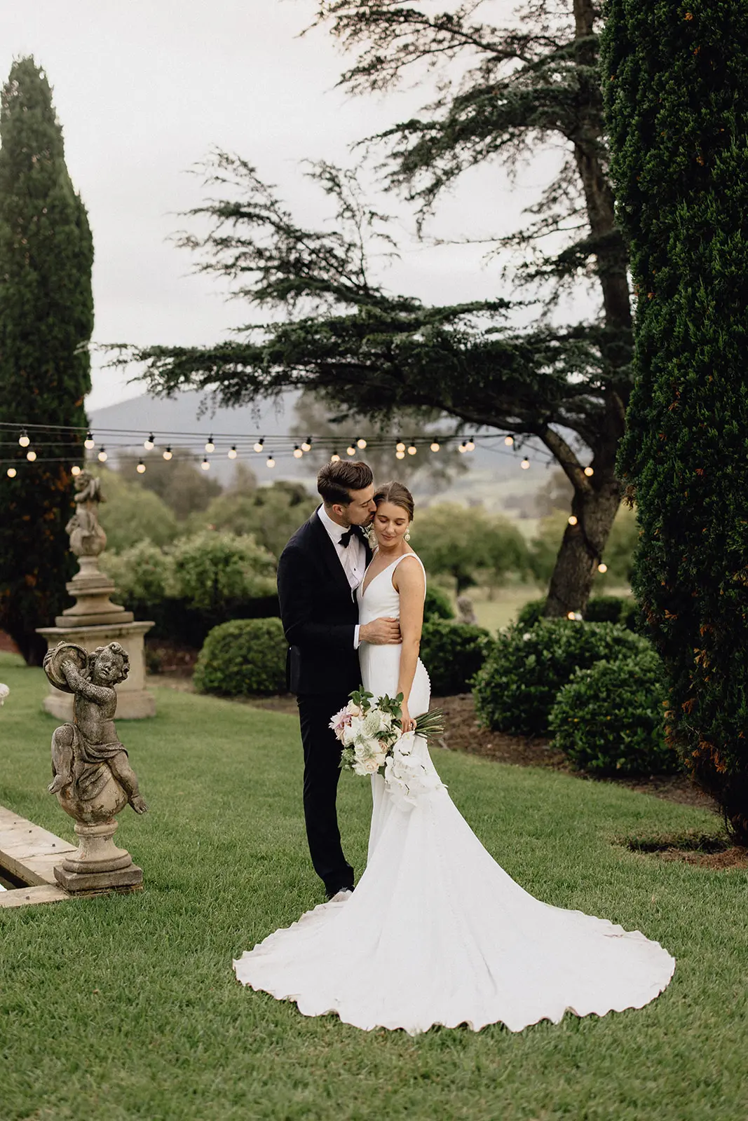Groom With Bride Wearing Minimalist Crepe Fit-And-Flare Wedding Dress Fernanda By Maggie Sottero