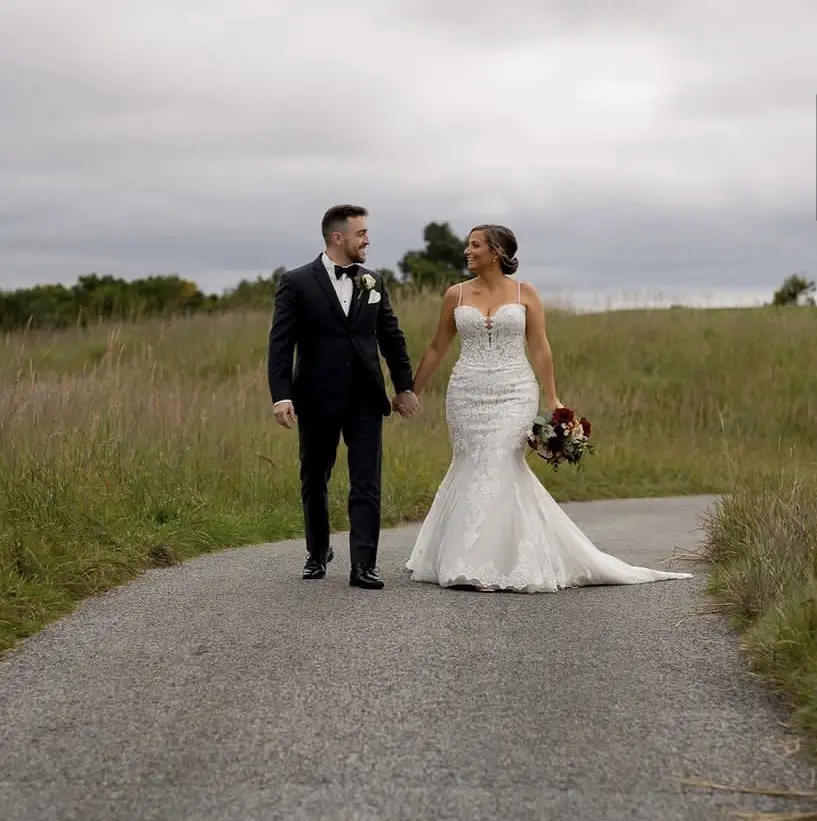 Bride wearing Fiona wedding gown by Maggie Sottero with her husband