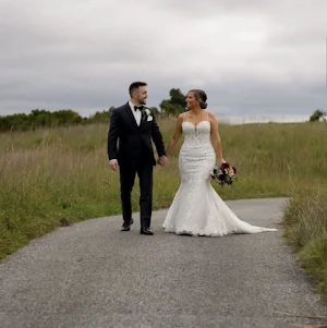 Bride wearing Fiona wedding gown by Maggie Sottero with her husband