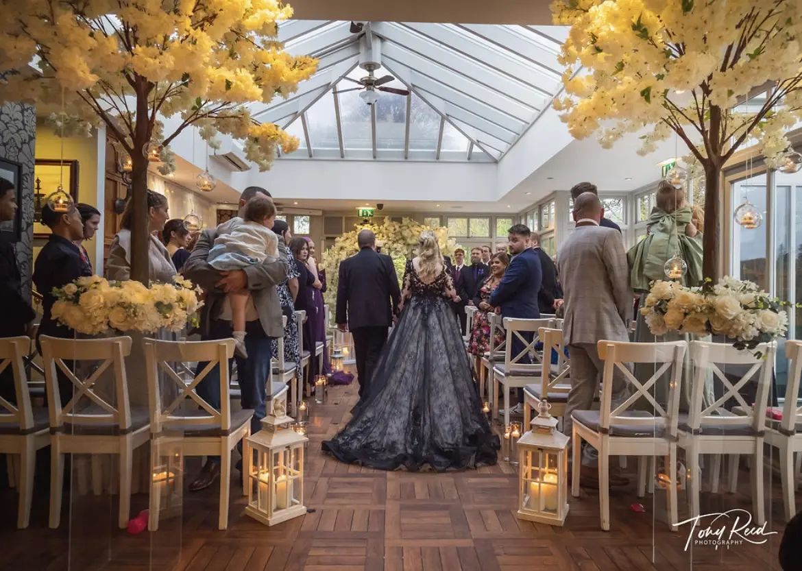 Groom Walking Bride Up The Aisle In A Black Lace Ball Gown Wedding Dress Named Zander By Sottero And Midgley