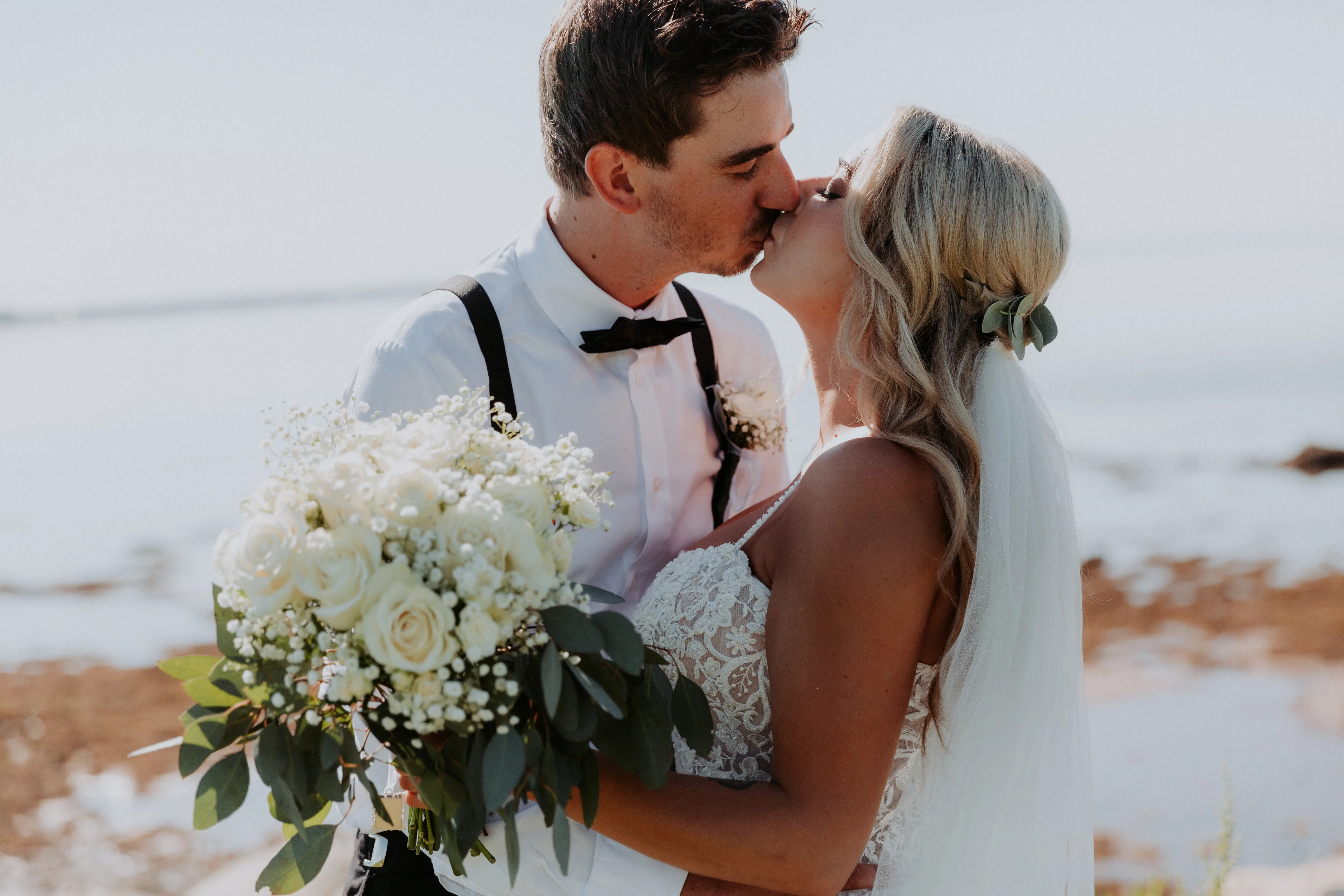 Groom with Bride in Flattering A-Line Spaghetti Strap Wedding Dress with Romantic Lace Called Marisol by Rebecca Ingram