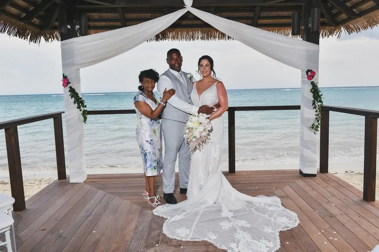 Bride wearing Franklynn by Sottero and Midgley with her husband and his mother