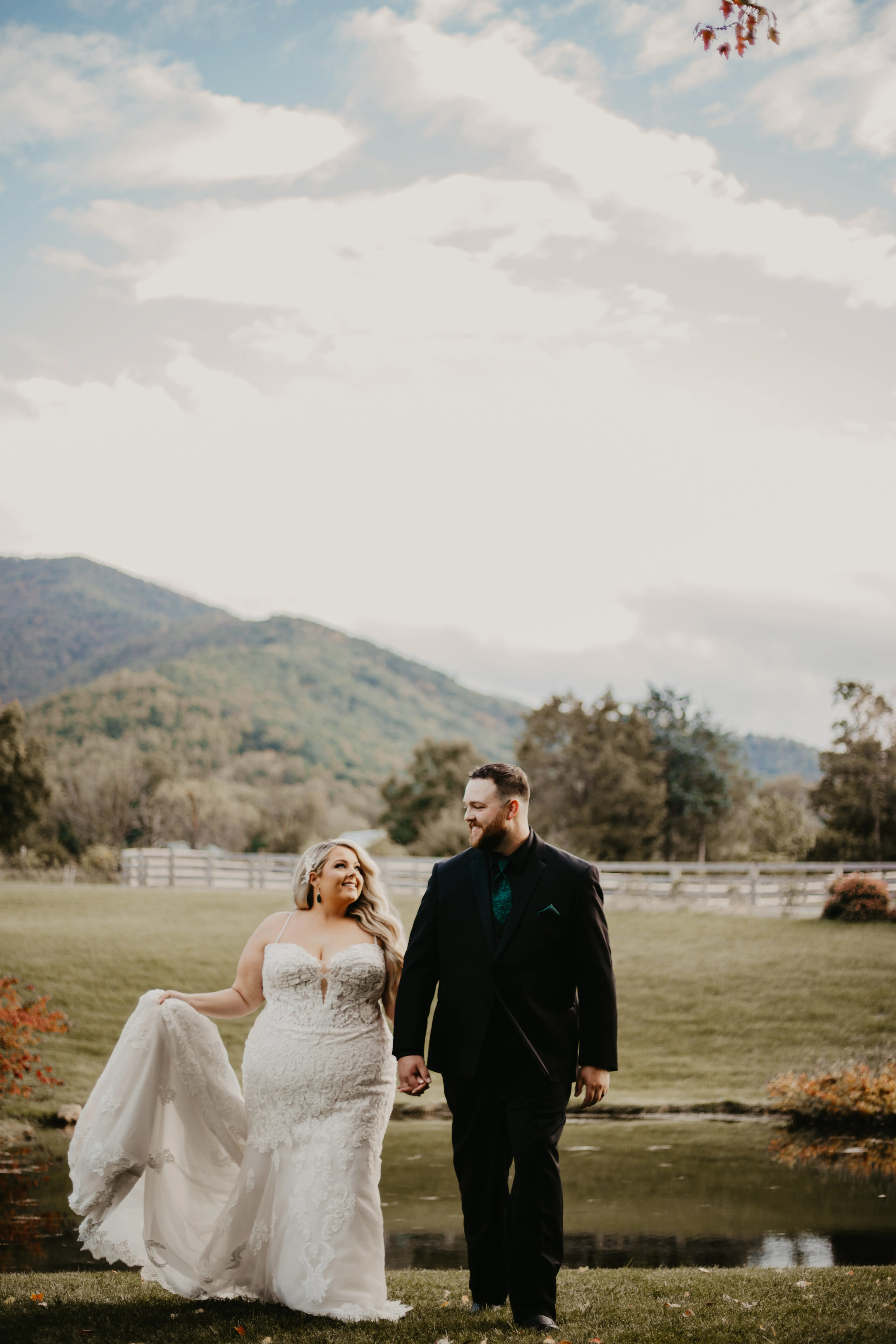 Bride wearing Fiona wedding gown by Maggie Sottero walking with her husband