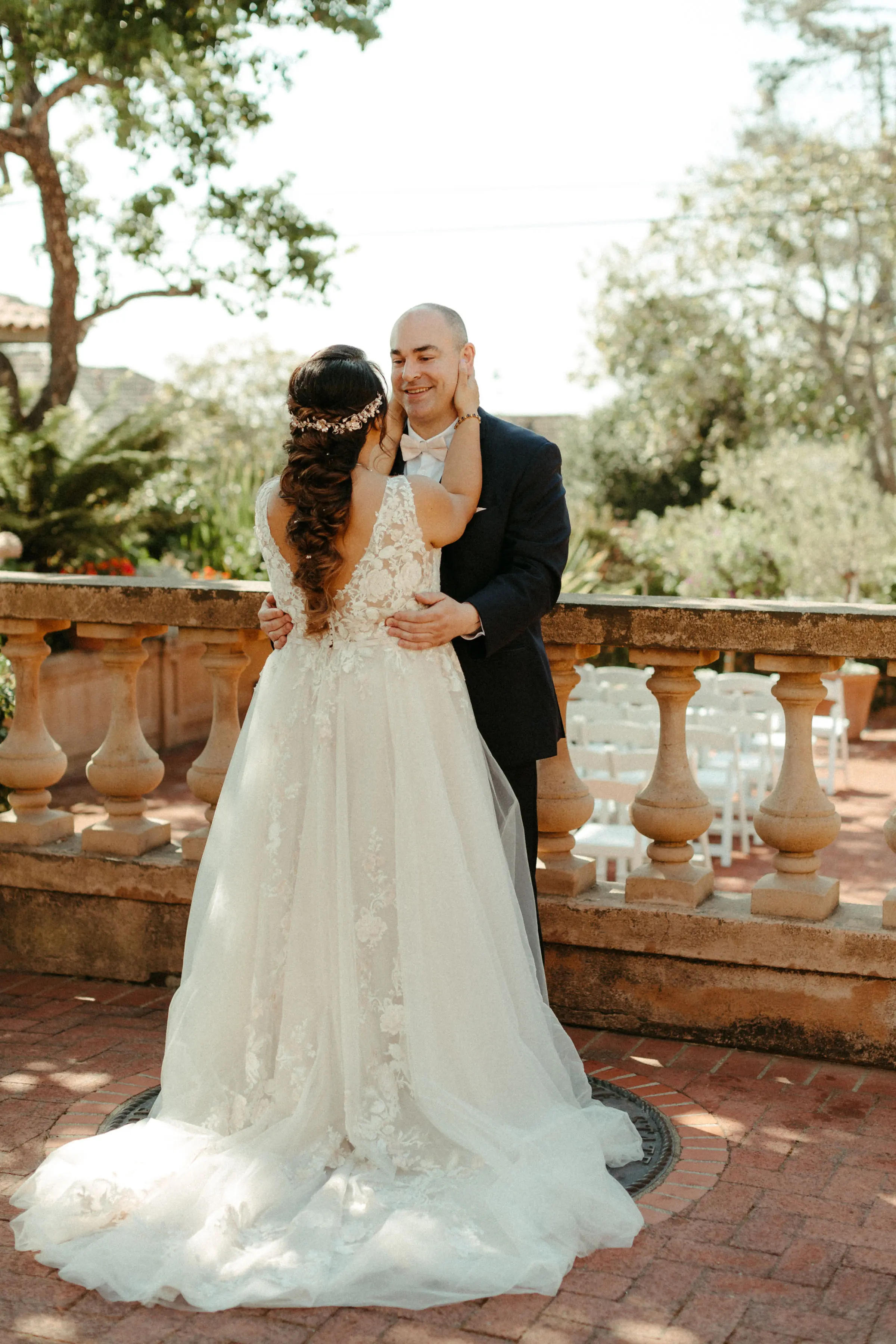Bride with groom wearing affordable A-Line floral motif wedding dress.