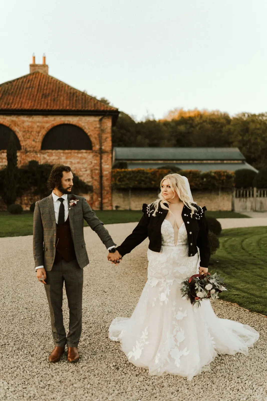 Bride Wearing Lace Mermaid Wedding Dress Called Hattie By Rebecca Ingram Holding Hands With Groom