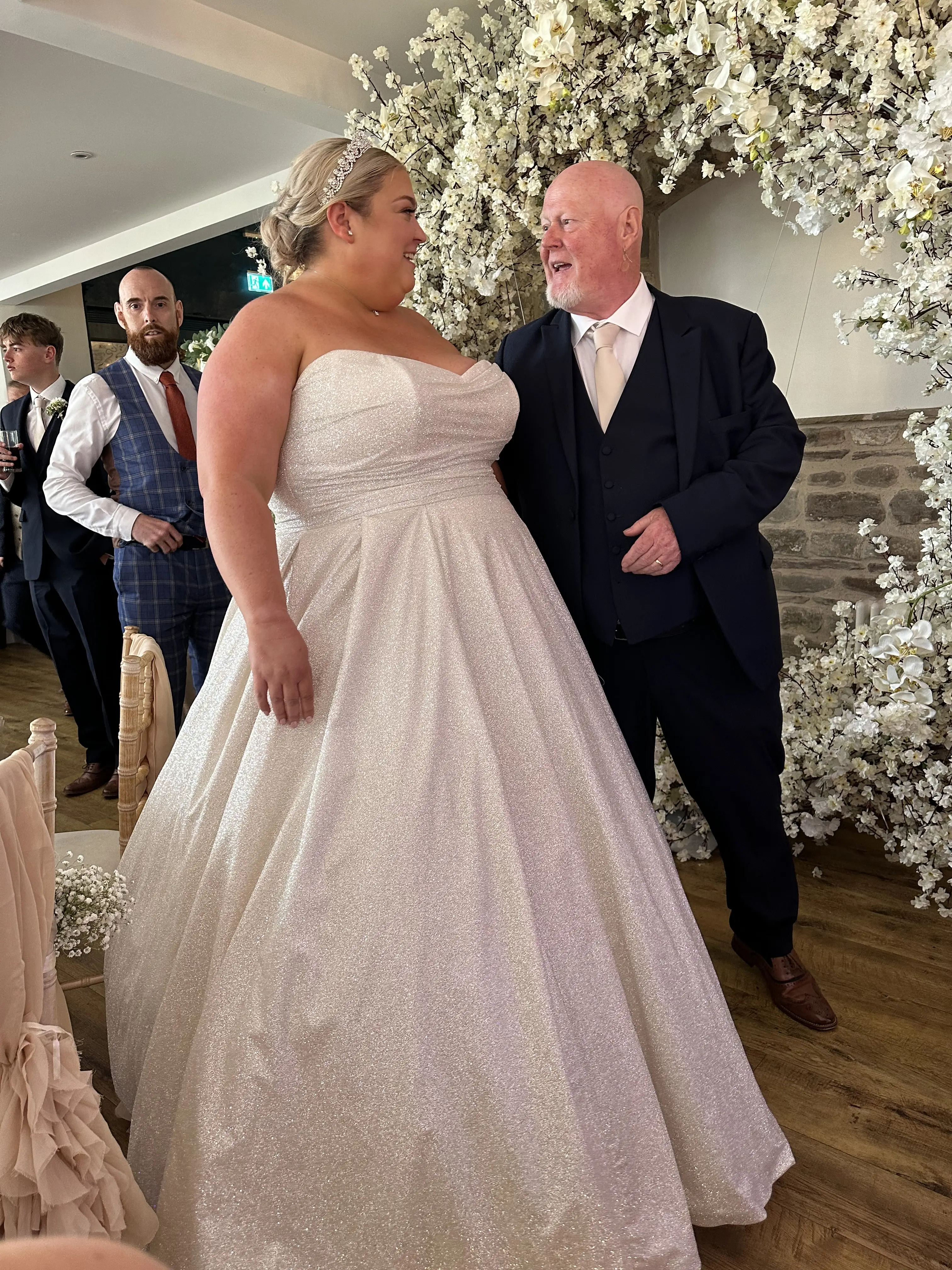 Bride wearing Anniston by Maggie Sottero talking to her dad