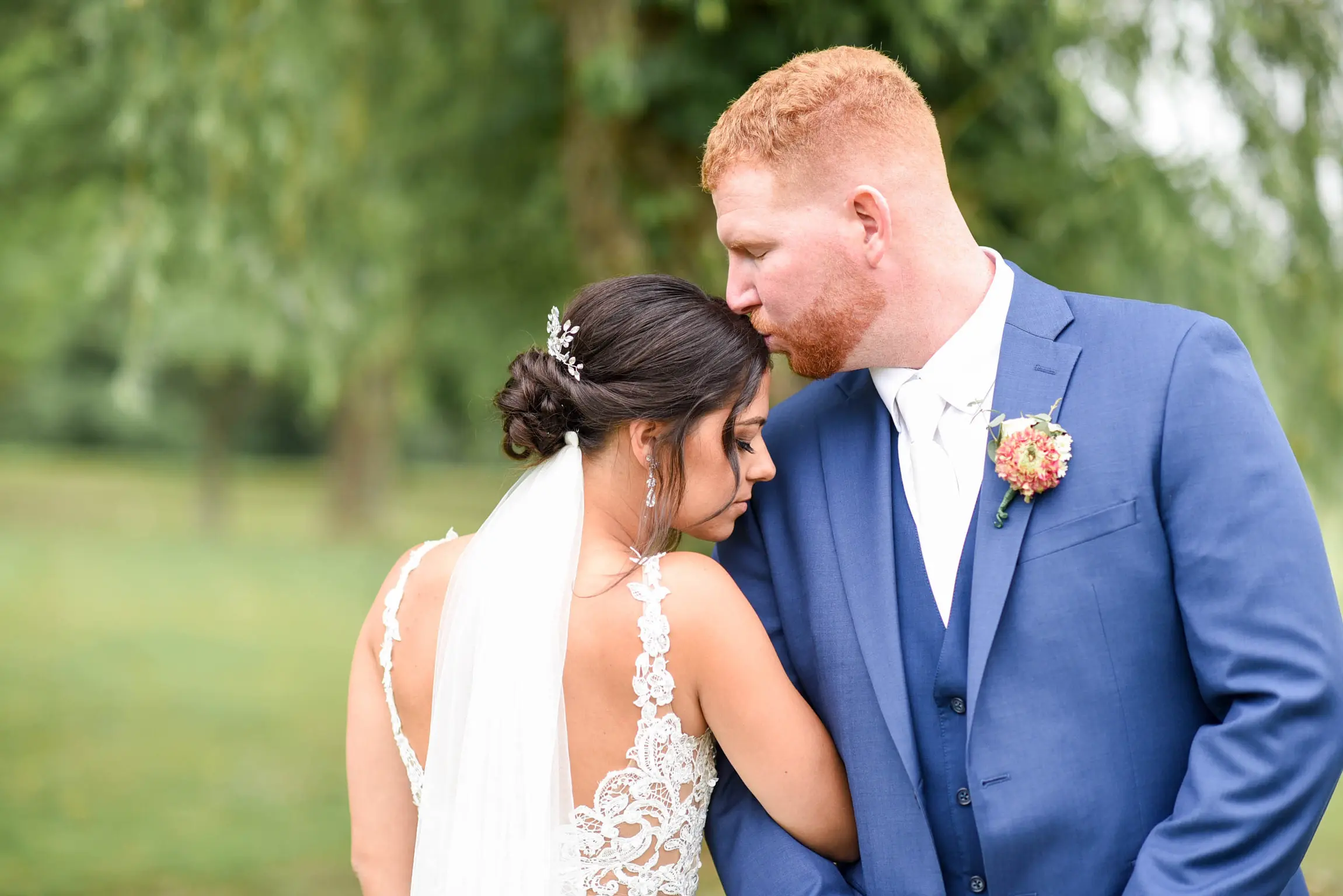Bride with groom wearing crepe sheath wedding dress