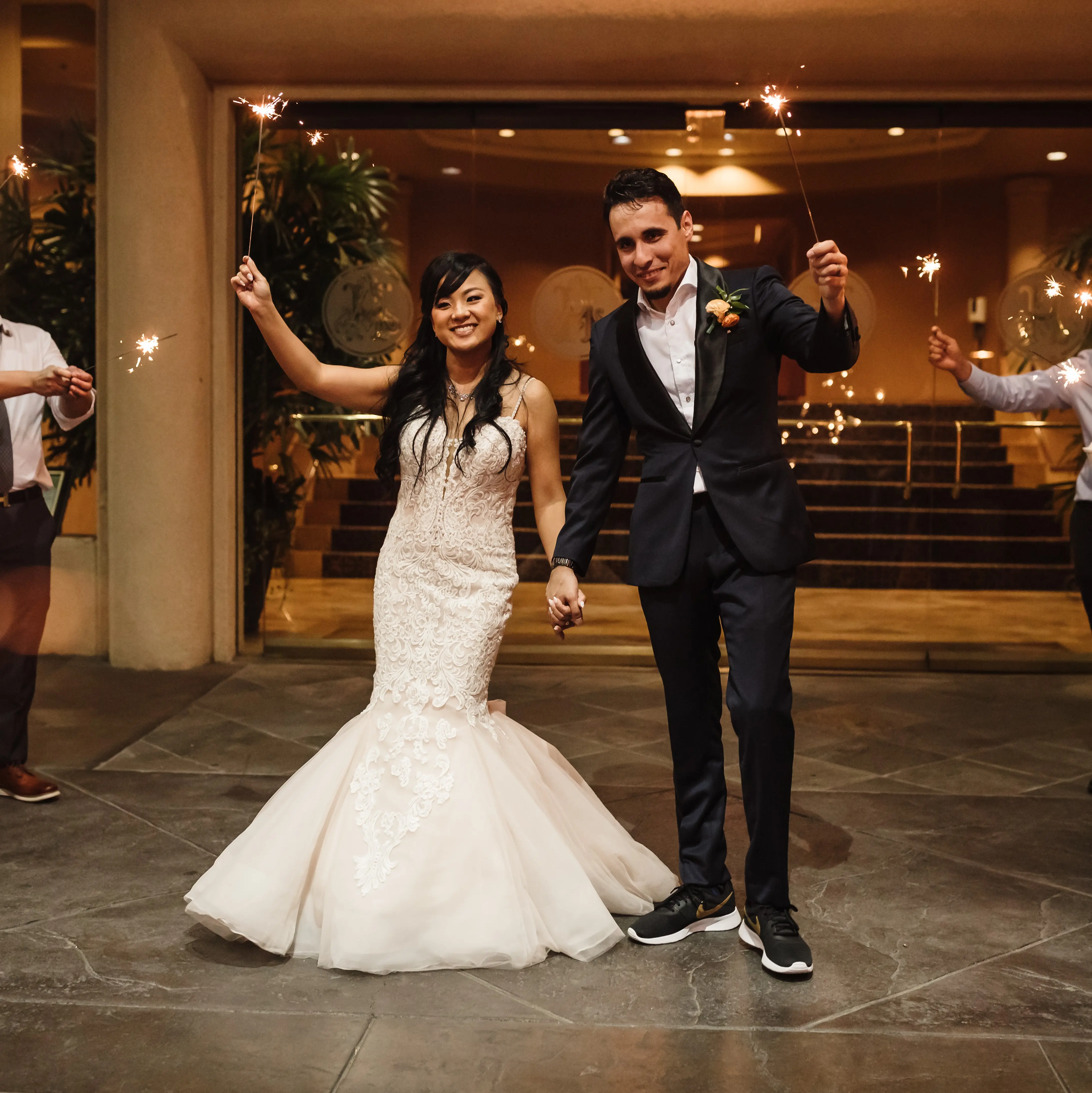 Bride Wearing Lace Fit and Flare Wedding Dress by Maggie Sottero Bride and Groom With Sparklers