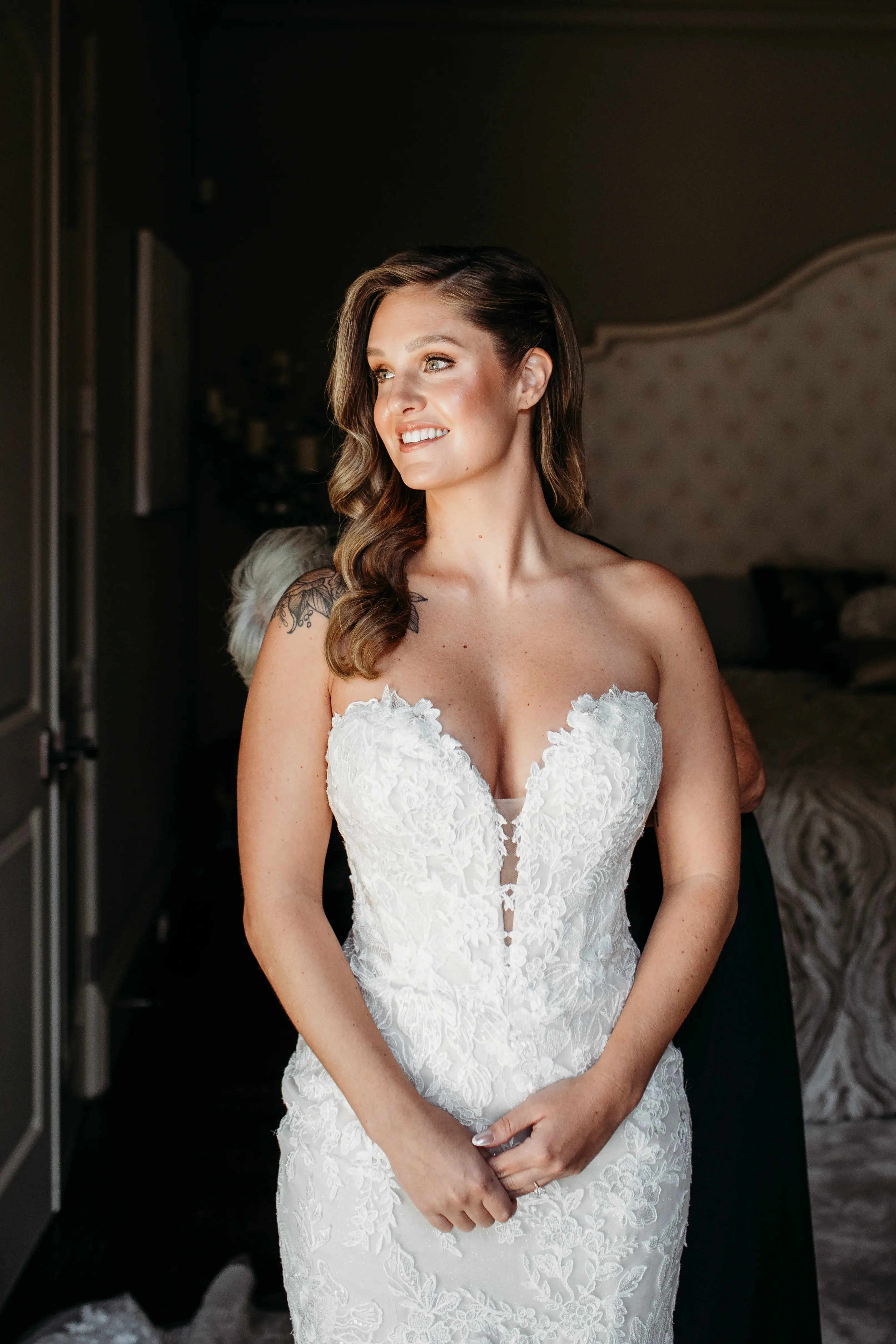 Bride Wearing Lace Mermaid Wedding Gown Called Montgomery By Sottero and Midgley Getting Ready