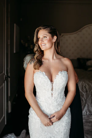 Bride Wearing Lace Mermaid Wedding Gown Called Montgomery By Sottero and Midgley Getting Ready