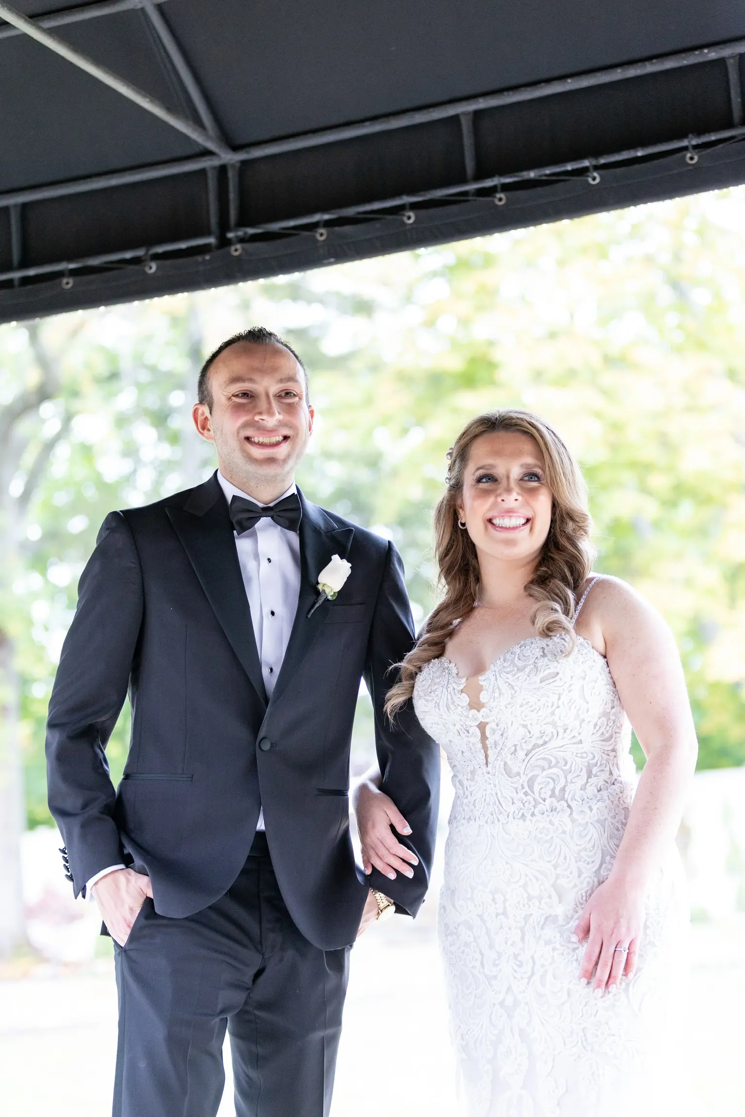 Bride Wearing Lace Fit-And-Flare Wedding Dress Called Fiona By Maggie Sottero With Groom