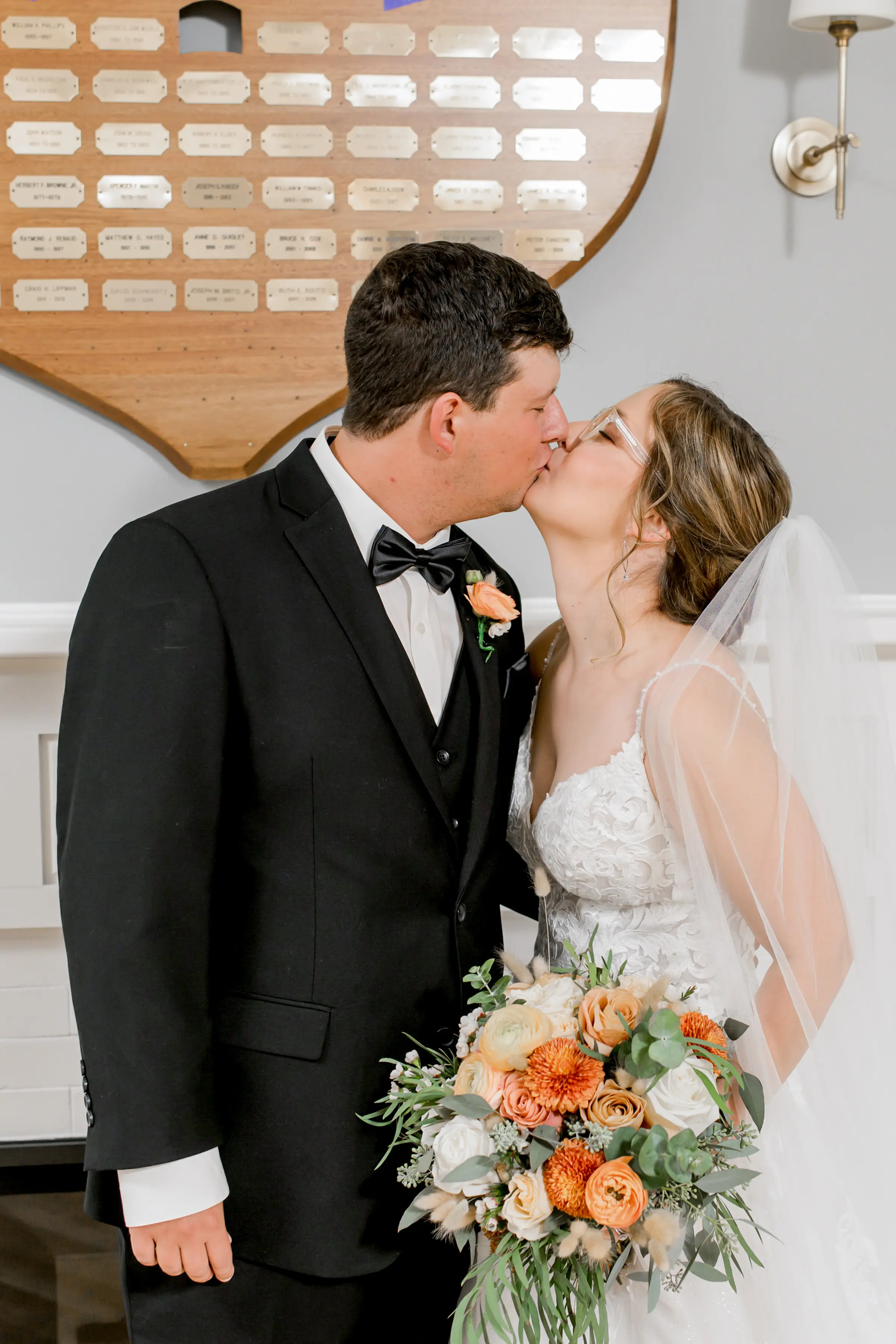 Bride wearing Florence wedding dress by Maggie Sottero kissing her husband