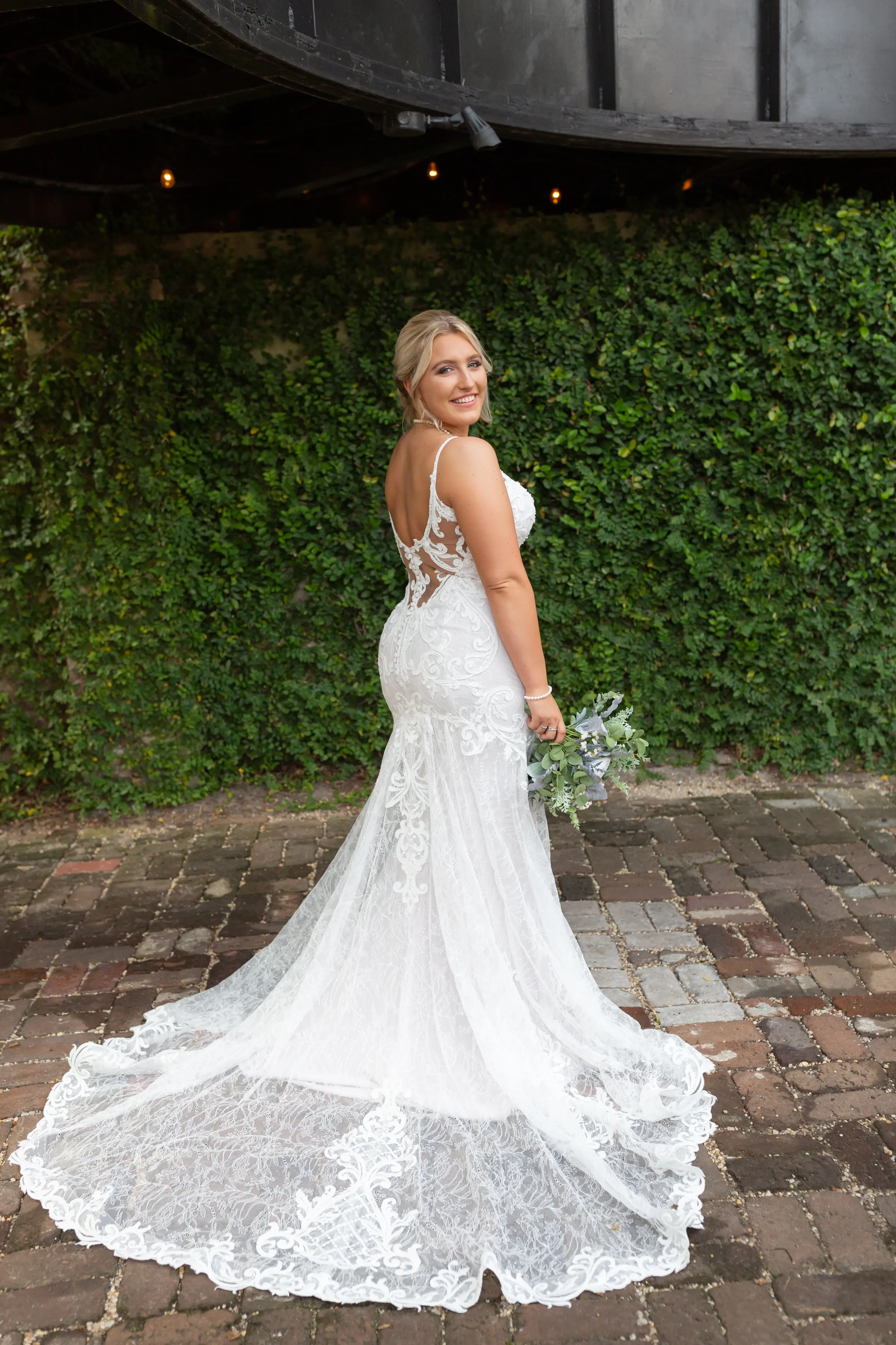 Smiling bride wearing wedding dress called Esther.