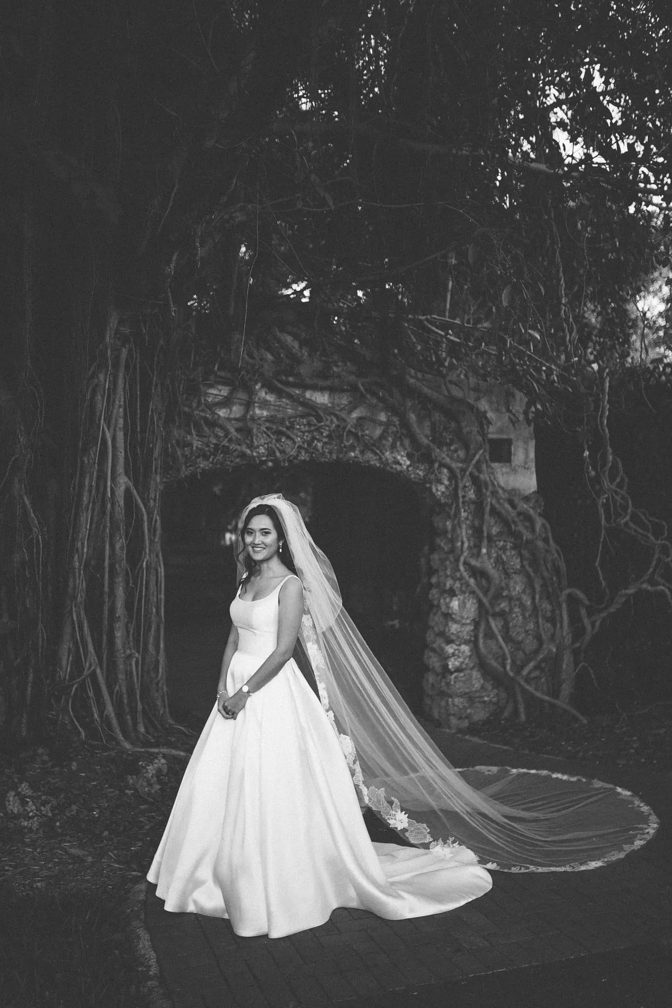 Bride Wearing Satin Ball Gown Wedding Dress Called Selena By Maggie Sottero With Long Veil