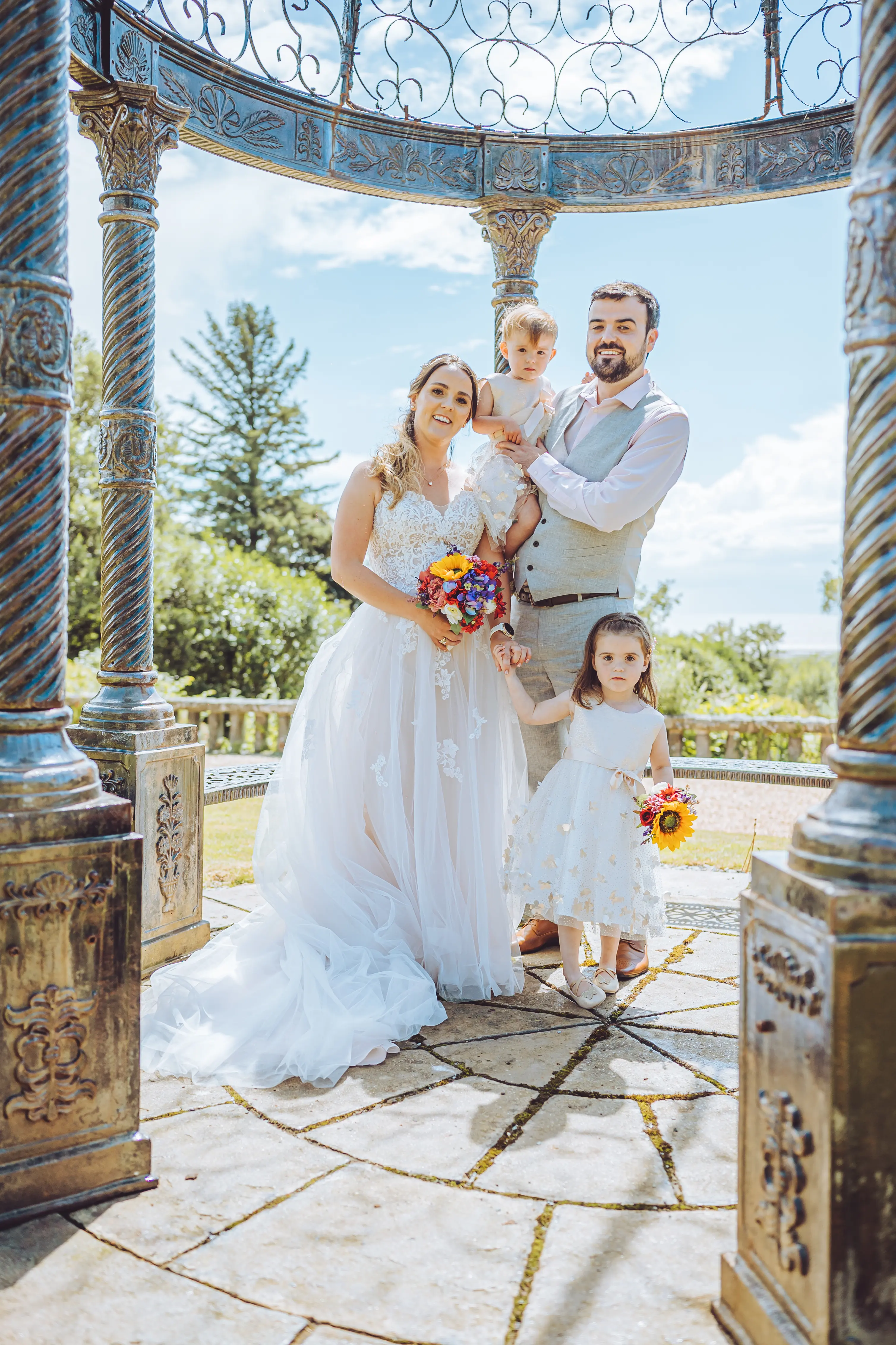 Groom With Bride Wearing A-Line Spaghetti Strap Wedding Dress Marisol By Rebecca Ingram