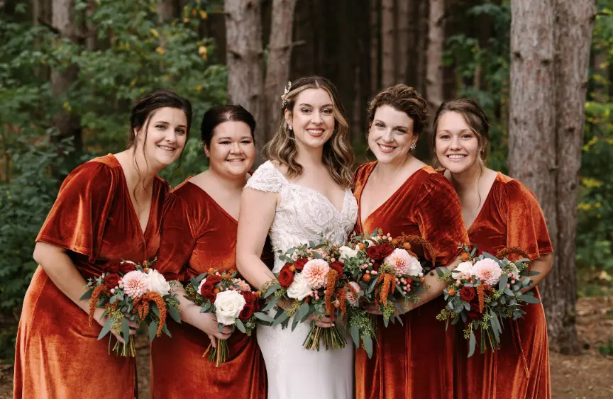 Bride Wearing Crepe Lace Wedding Dress Called Anson By Sottero And Midgley With Bridemaids Wearing Rust Colored Gowns
