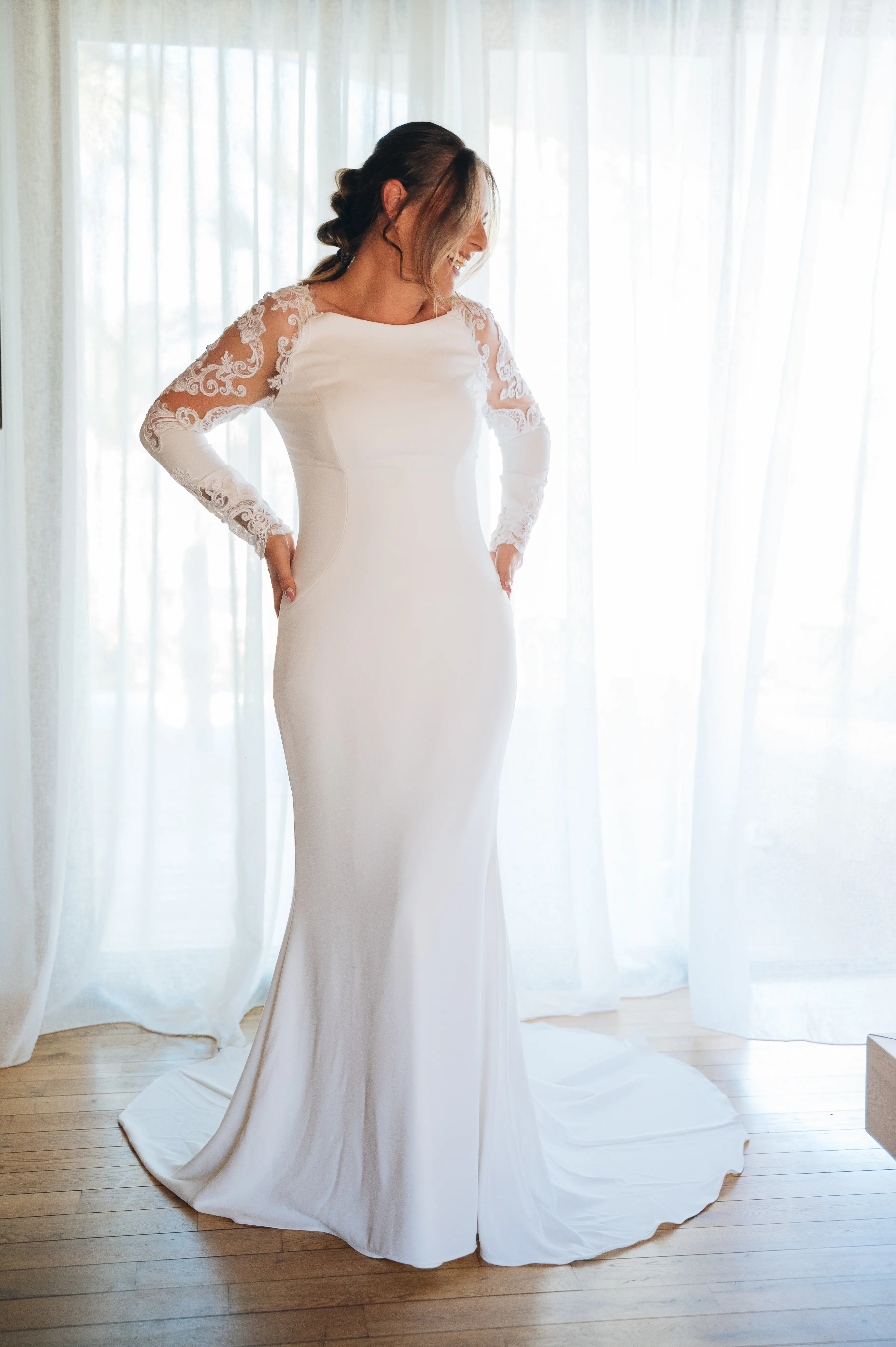 Real Bride in Minimalist Crepe Long Sleeve Lace Sheath Wedding Dress Called Bethany by Rebecca Ingram