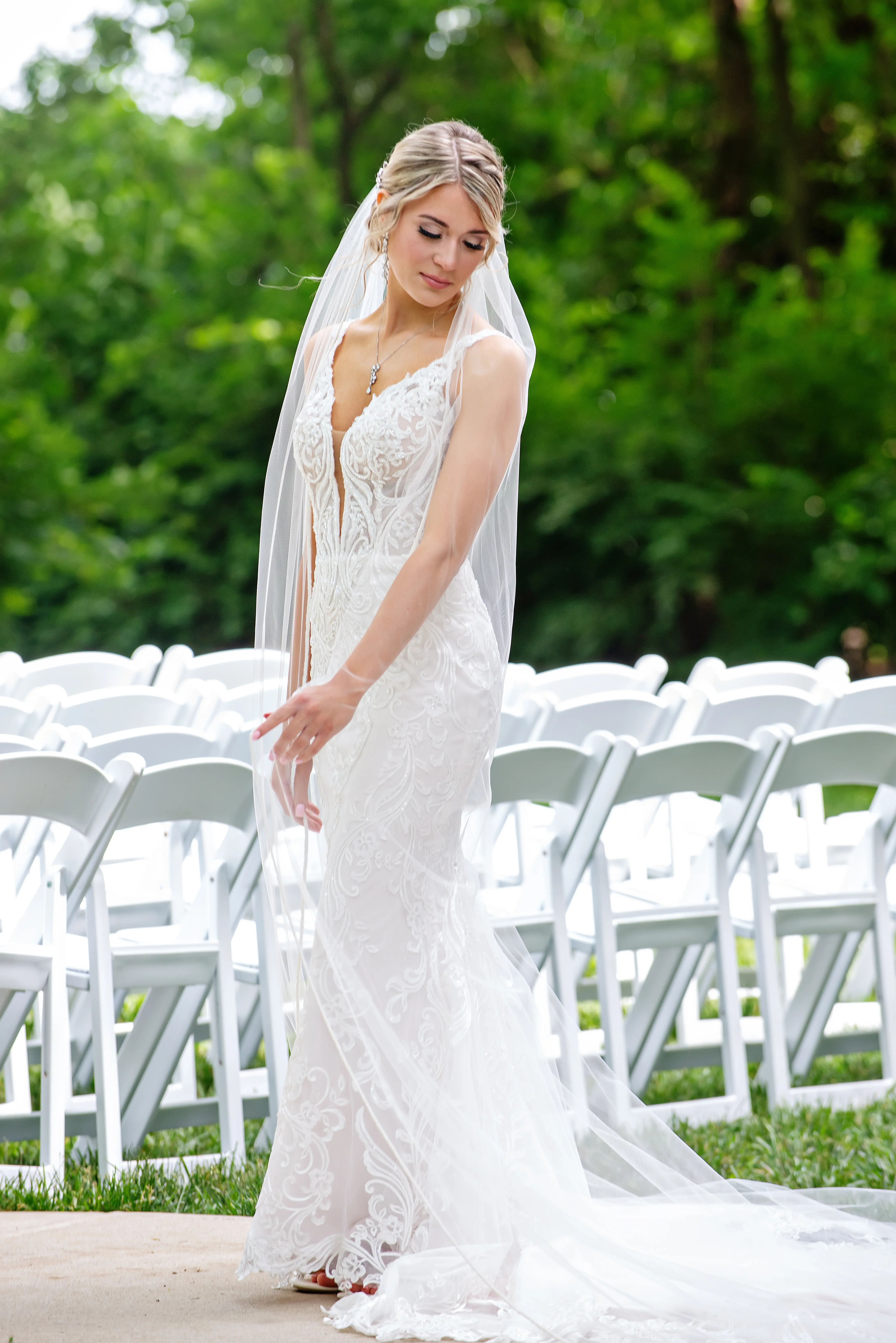 Bride in Elegant Lace Sheath Wedding Dress with Beaded Lace Motifs over Textured Tulle Called Hamilton by Sottero & Midgley