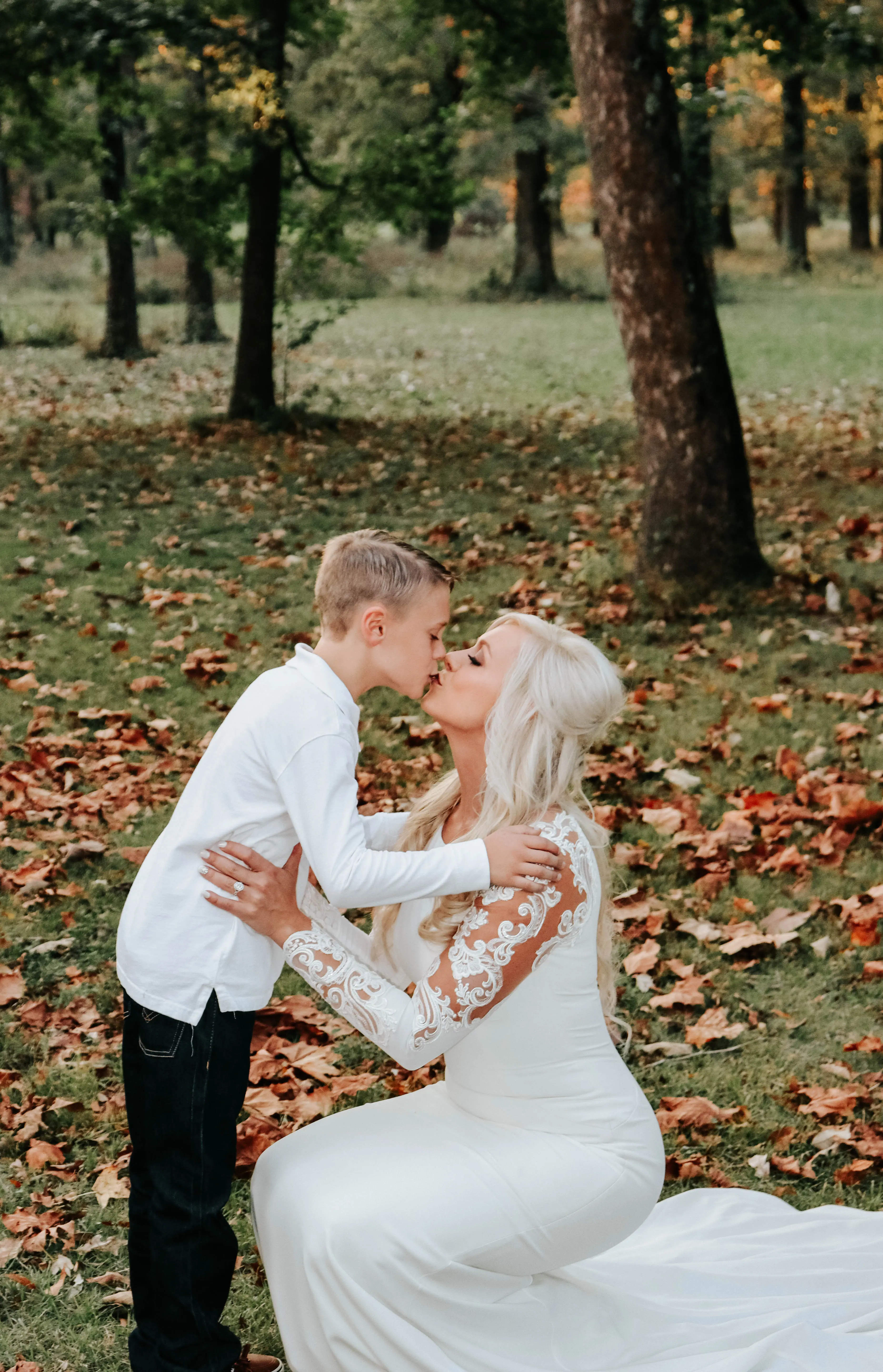 Bride wearing minimalist crepe long sleeve lace sheath wedding dress