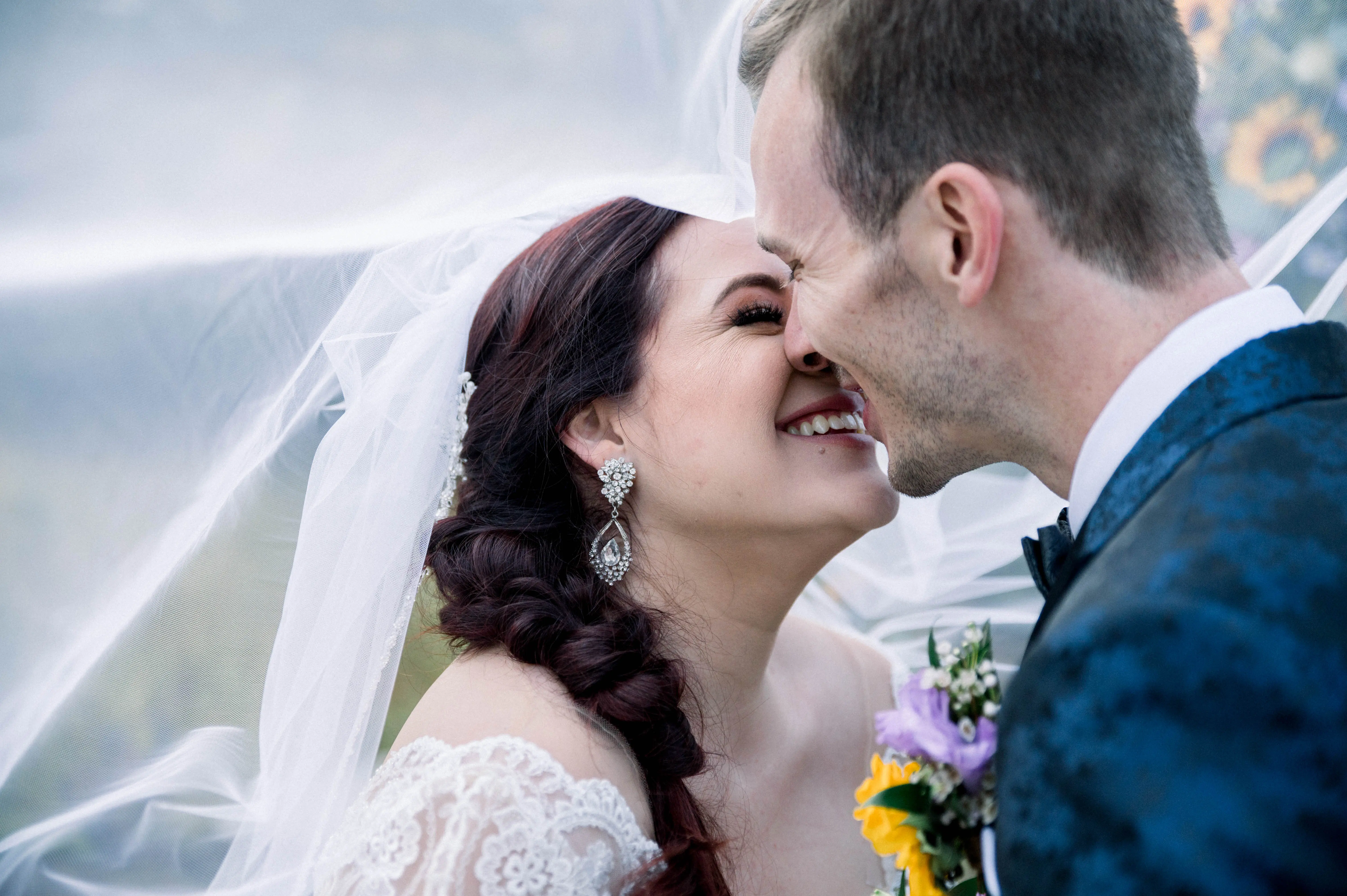 Bride Wearing Princess Wedding Dress Called Mallory Dawn By Maggie Sottero Kissing the Groom