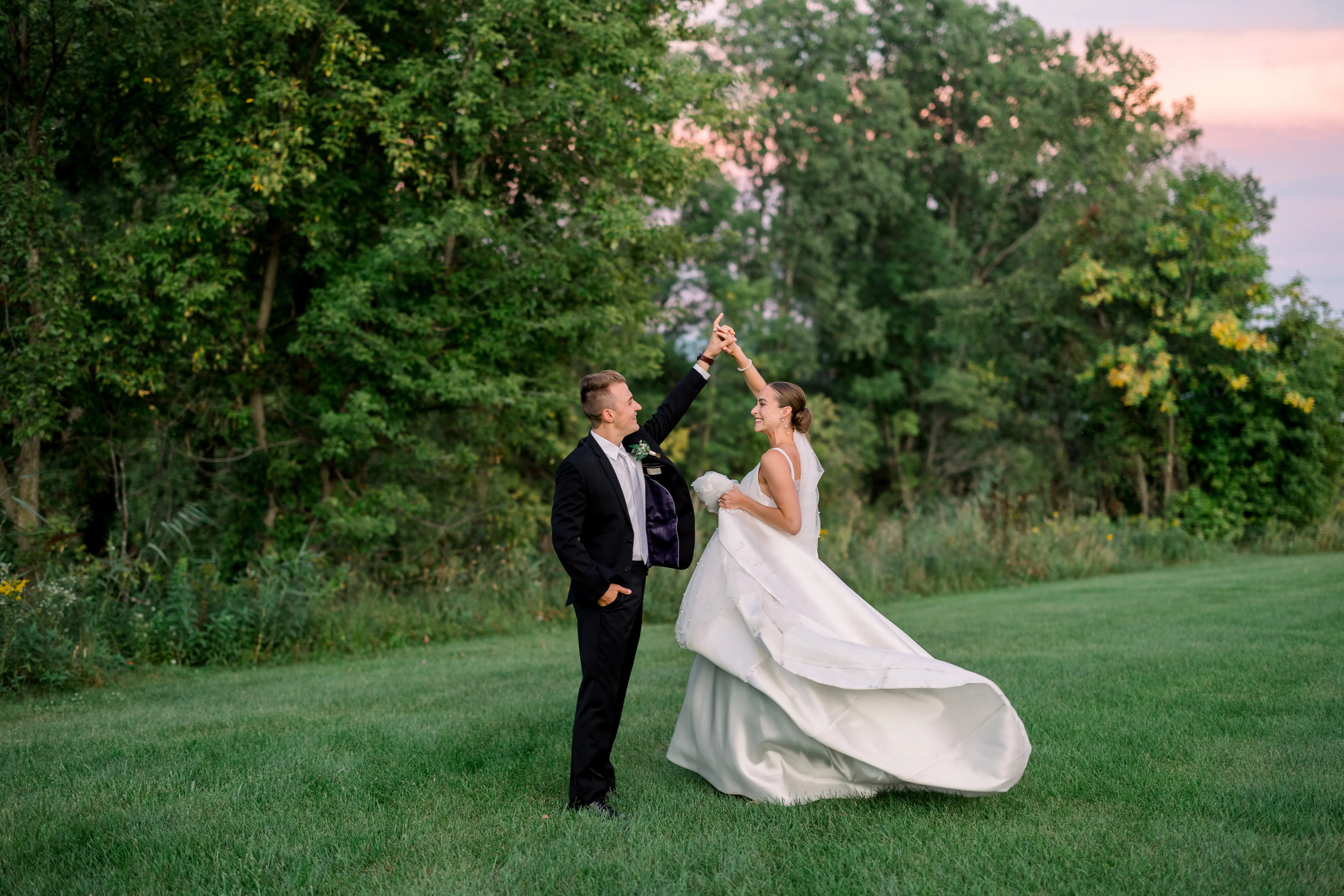 Bride Wearing Classic A-Line Wedding Dress Called Selena By Maggie Sottero Dancing With Groom