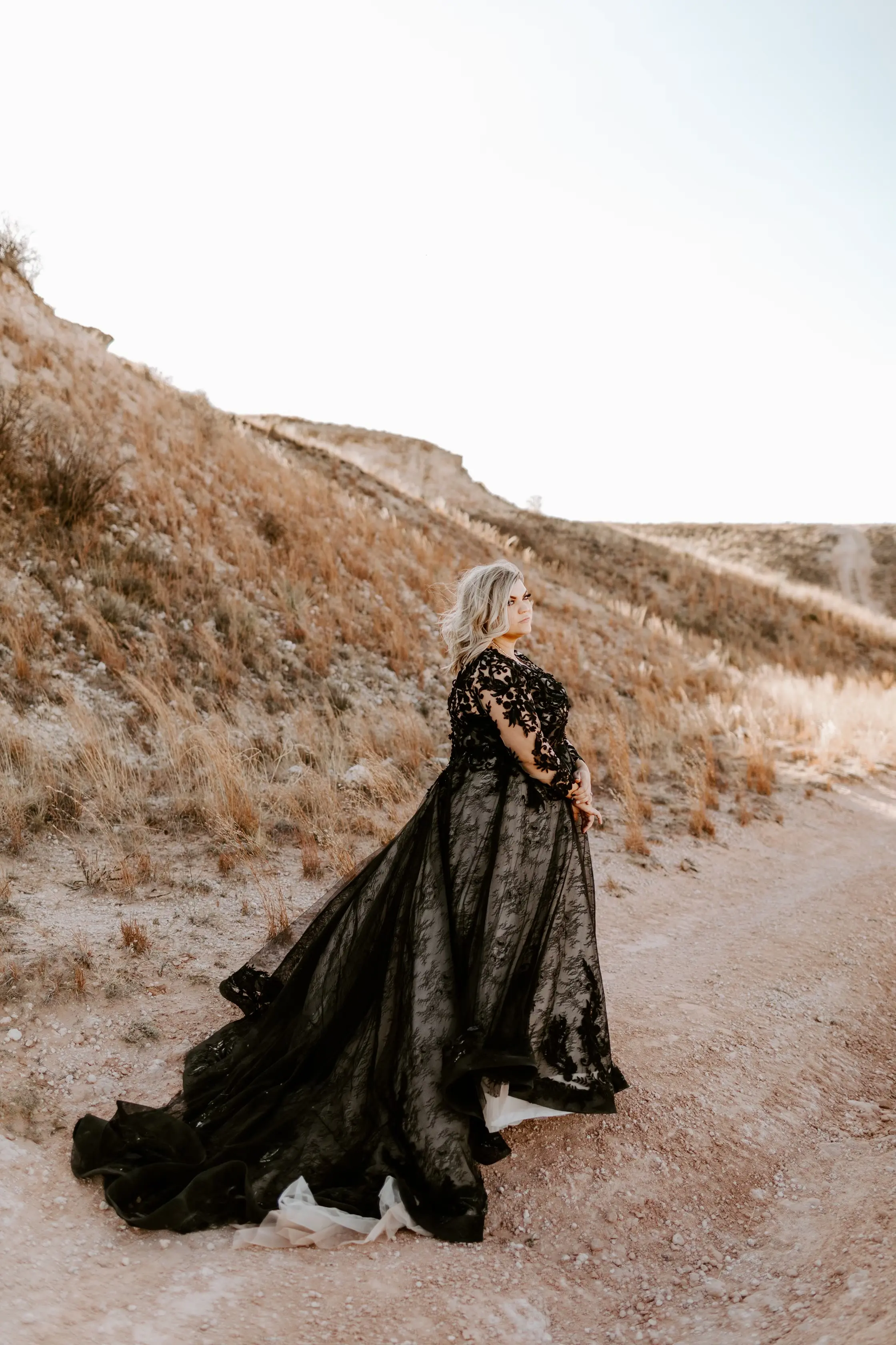 Bride Wearing Black Lace Wedding Dress Called Zander By Sottero And Midgley On A Dessert Hill