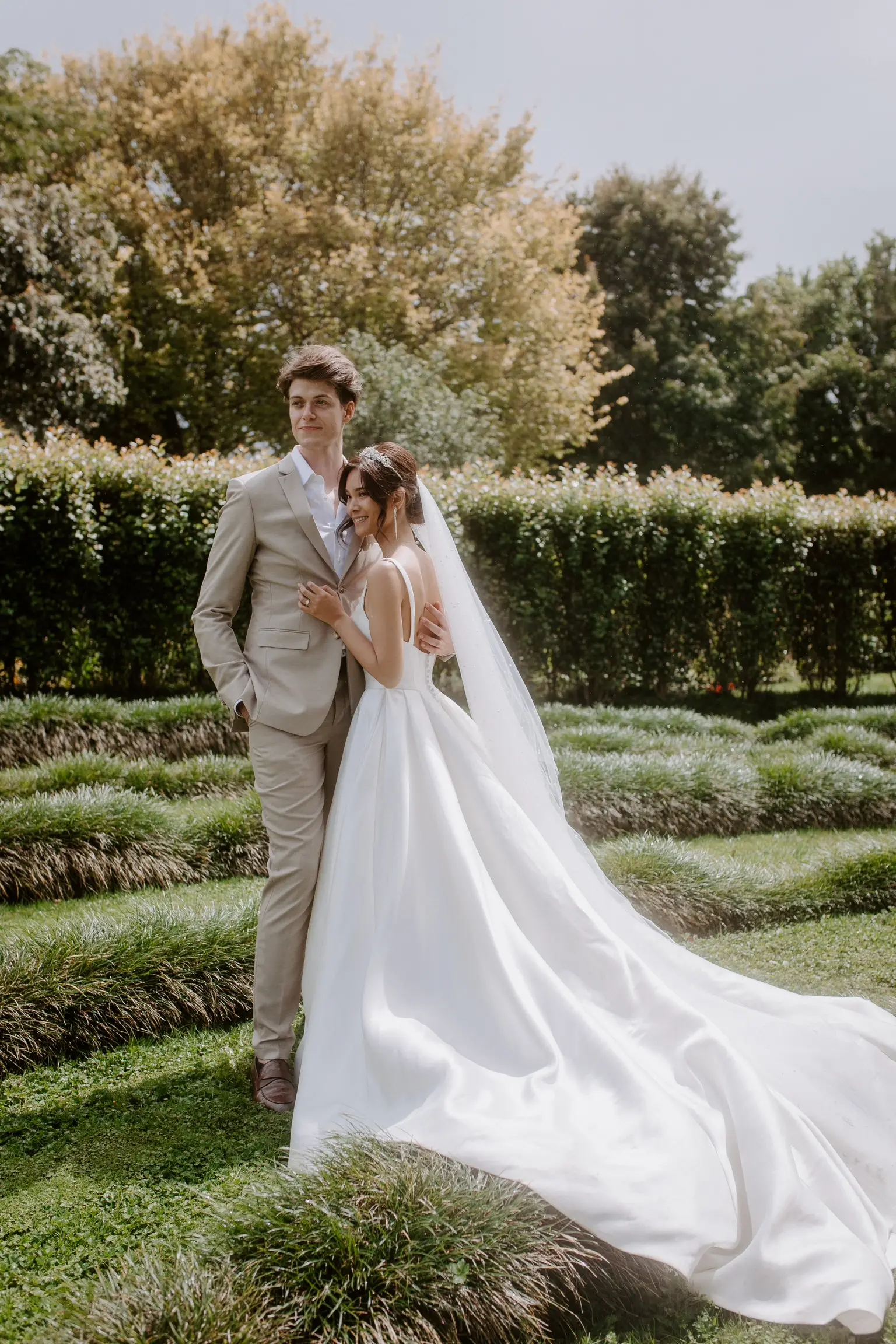 Bride In Satin A-Line Wedding Dress Called Selena By Maggie Sottero With Groom