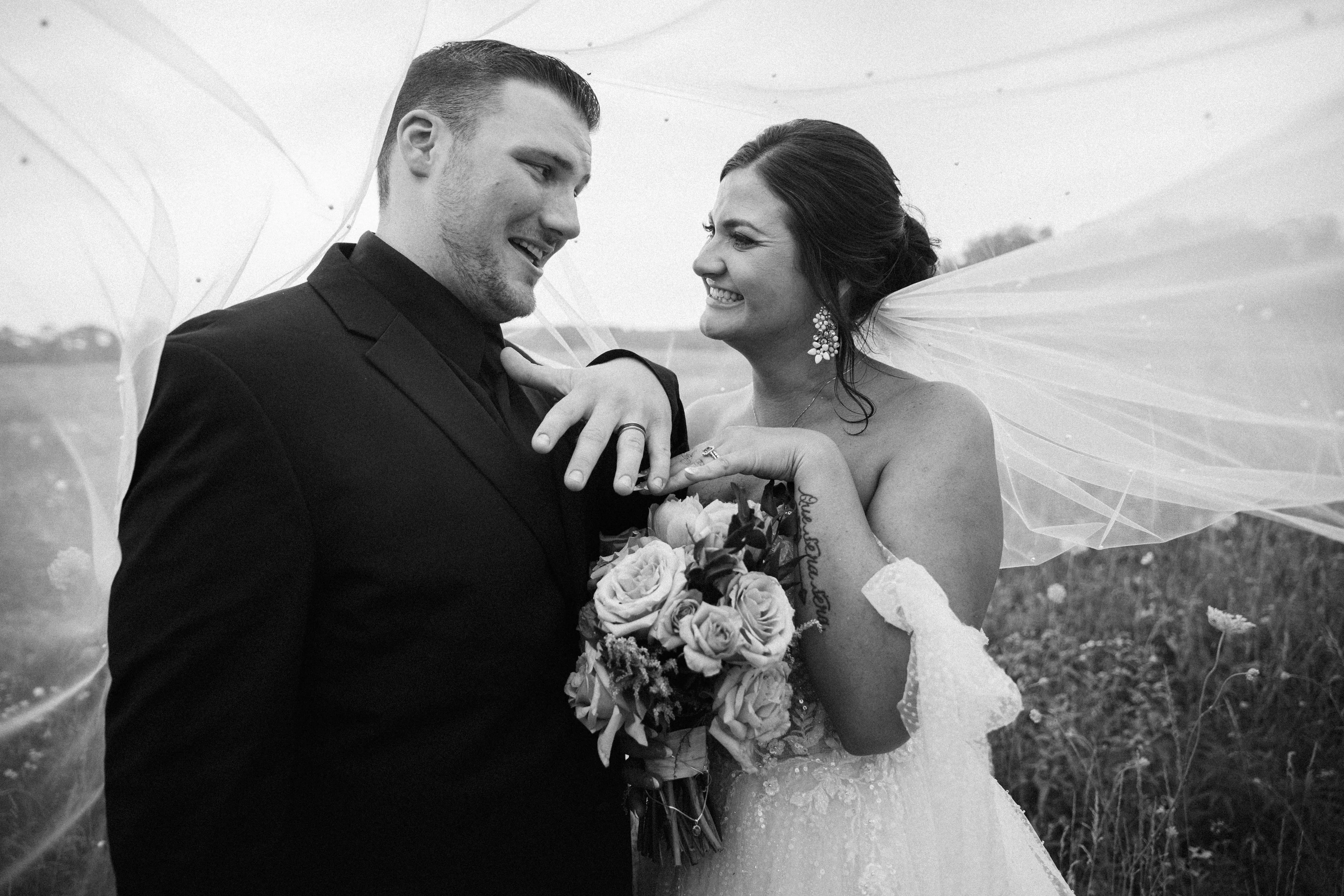 Bride Wearing Sparkly Ballgown Wedding Dress Called Shasha By Sottero And Midgley And Groom Showing Off Their Rings