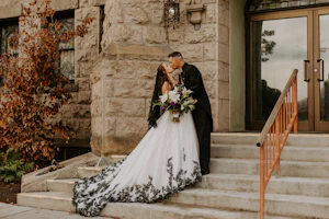 Bride wearing Black Lace Ballgown Wedding Dress called Tristyn by Maggie Sottero kissing the groom