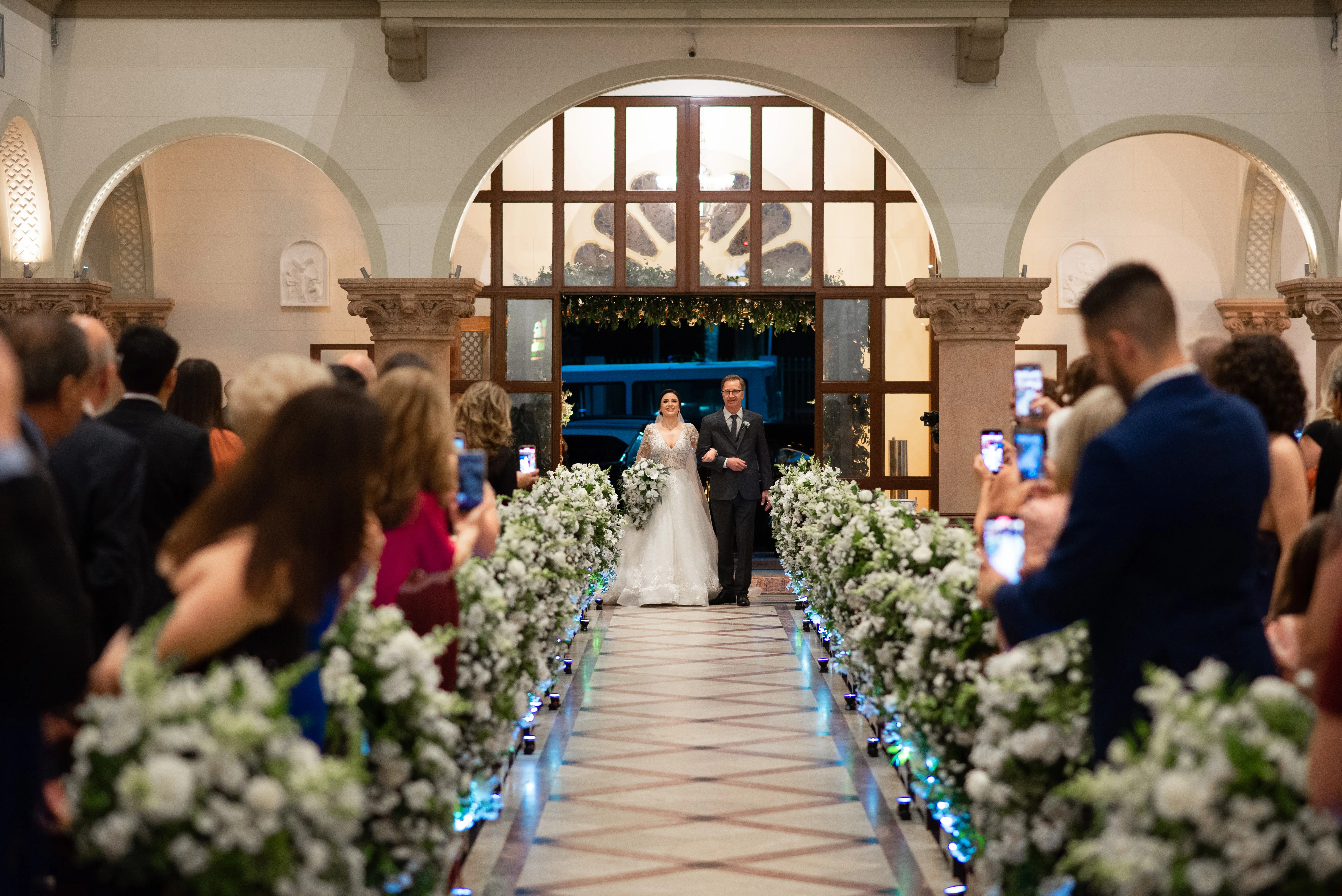 Bride Smiling While Wearing Lace A-Line Wedding Dress Called Zander By Sottero And Midgley Walking With Father
