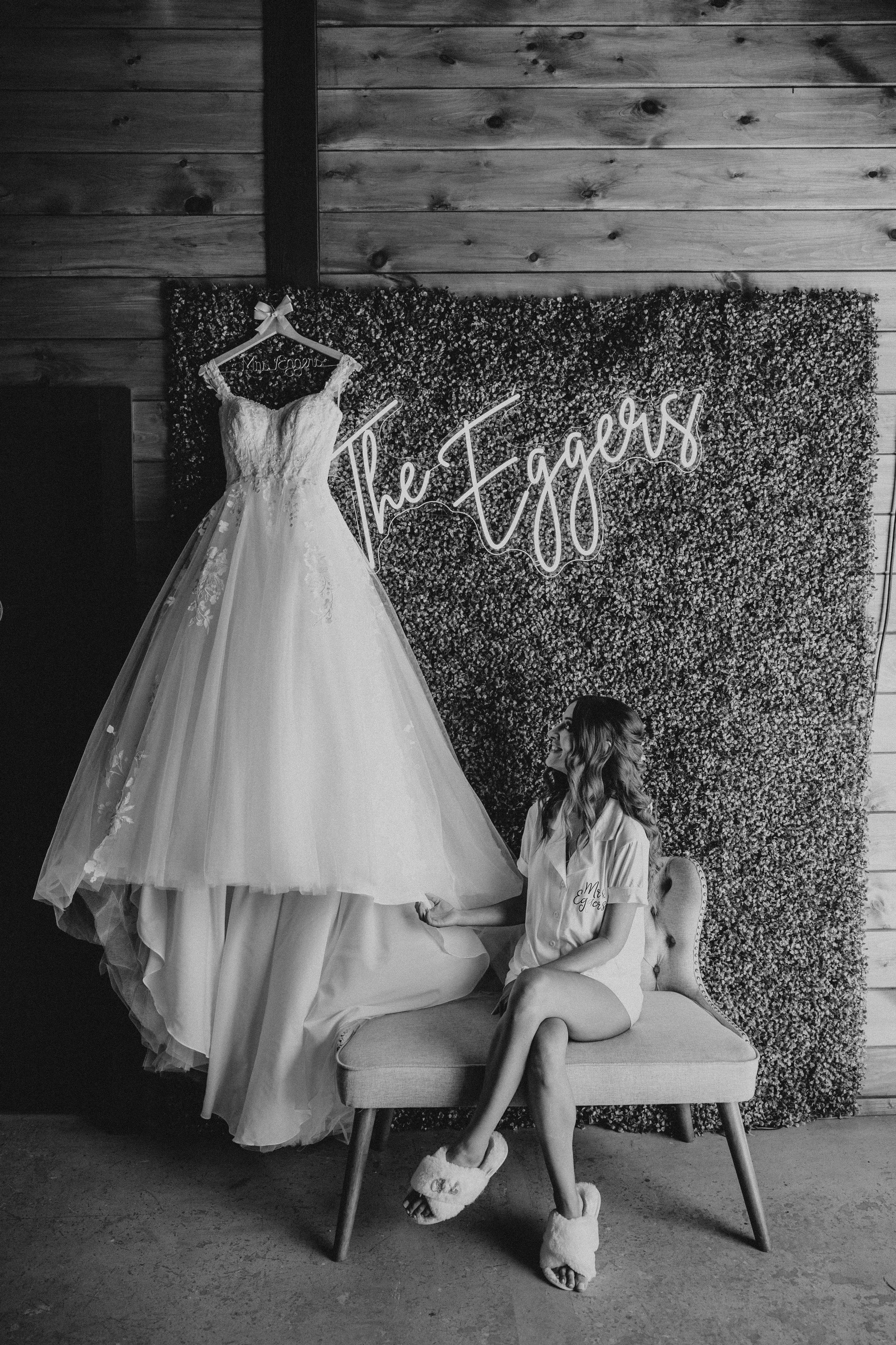 Bride looking at Harlem wedding dress by Maggie Sottero