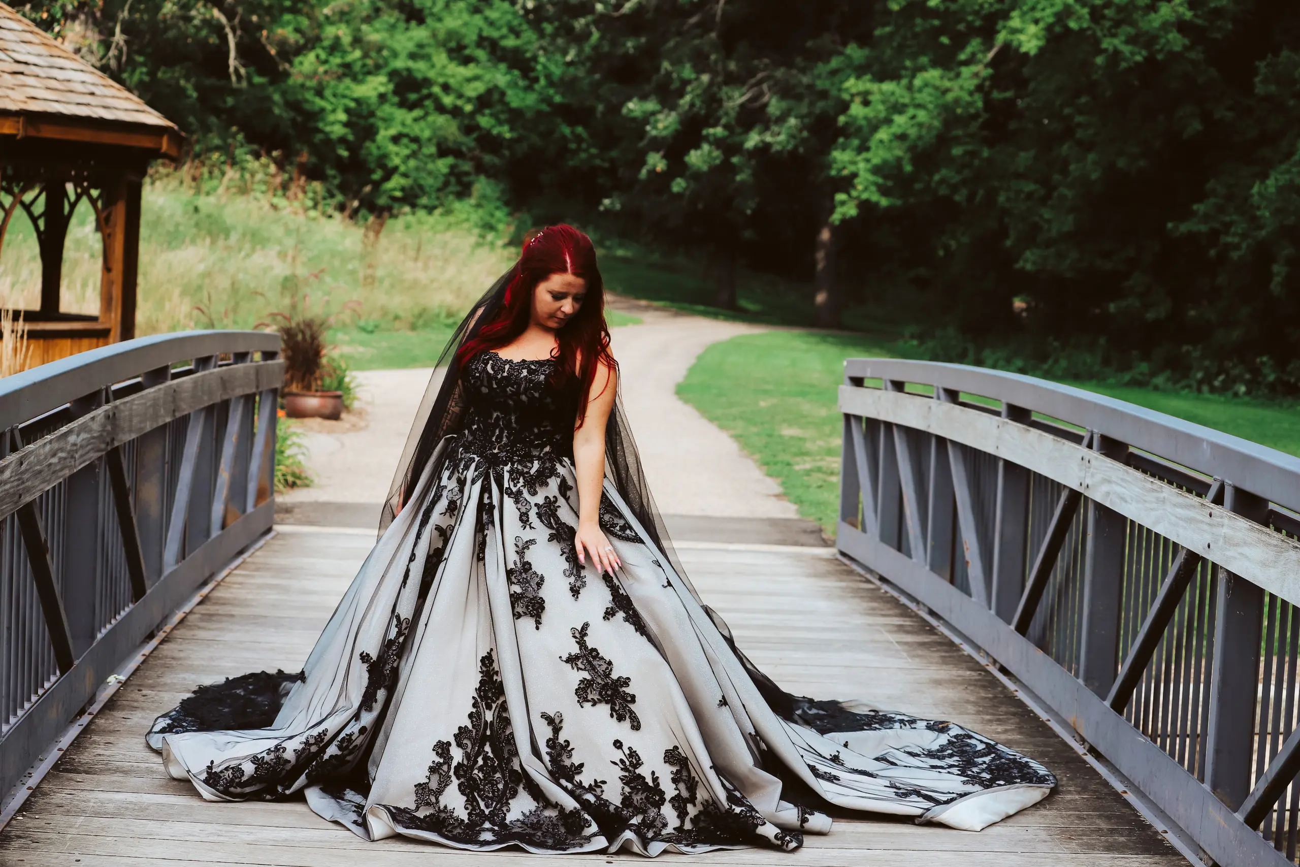 Bride Wearing Royal-Inspired Ball Gown Wedding Dress In Black Lace Called Norvinia By Sottero And Midgley