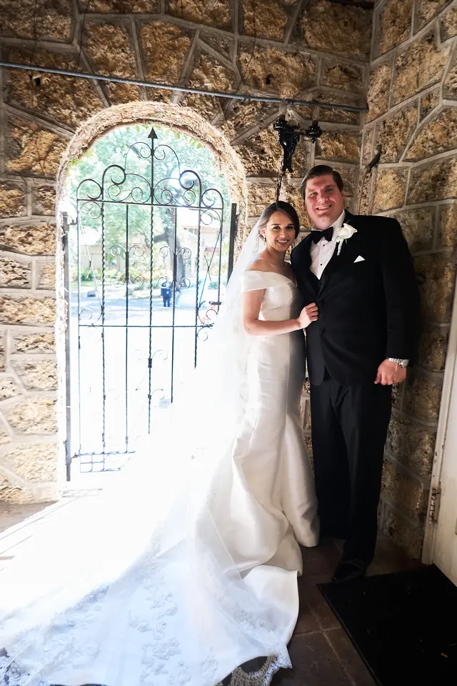 bride with groom in off the shoulder elegant wedding dress