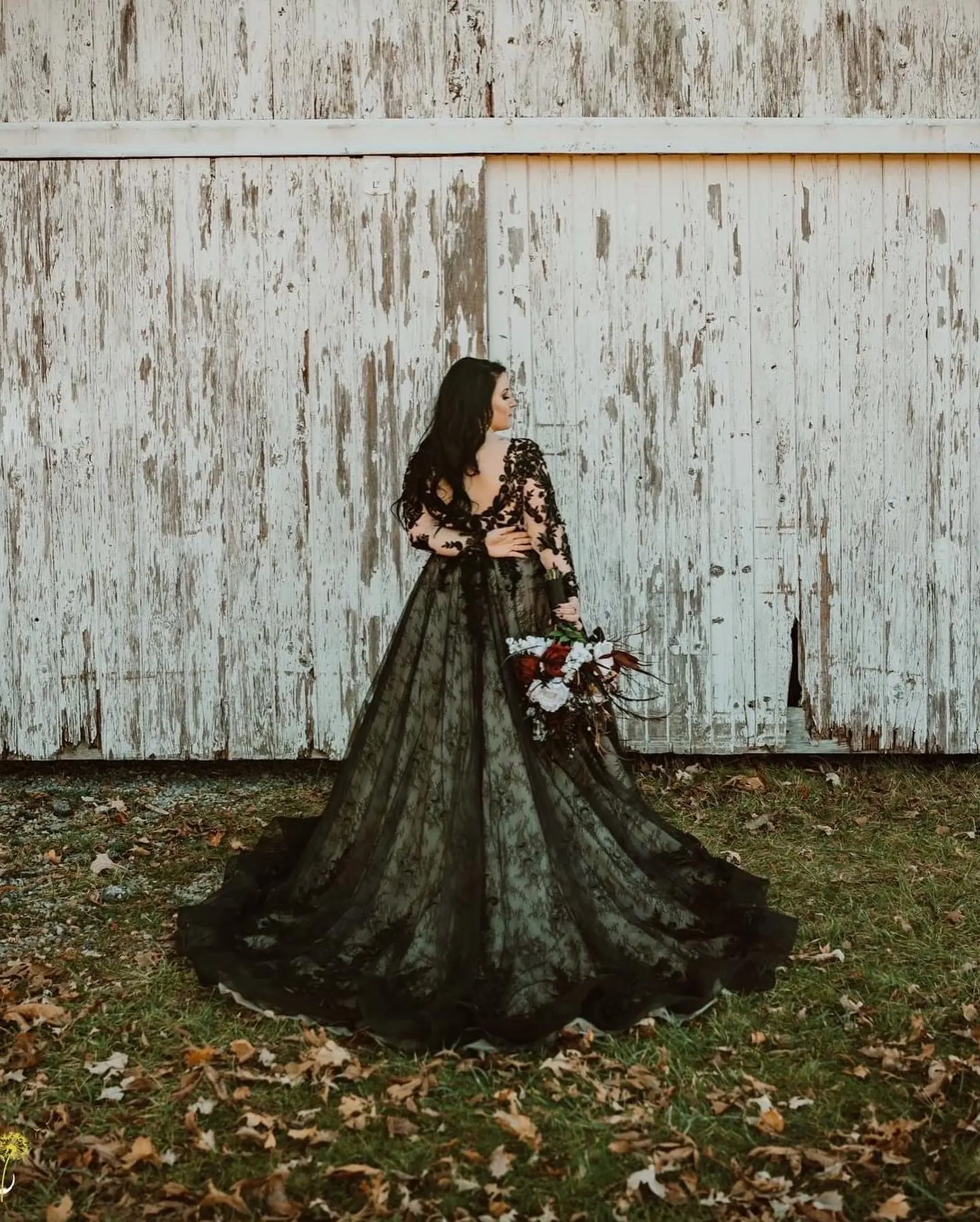 Bride Wearing Beautiful Low Back Black Wedding Dress With Lace Motifs Called Zander By Sottero And Midgley