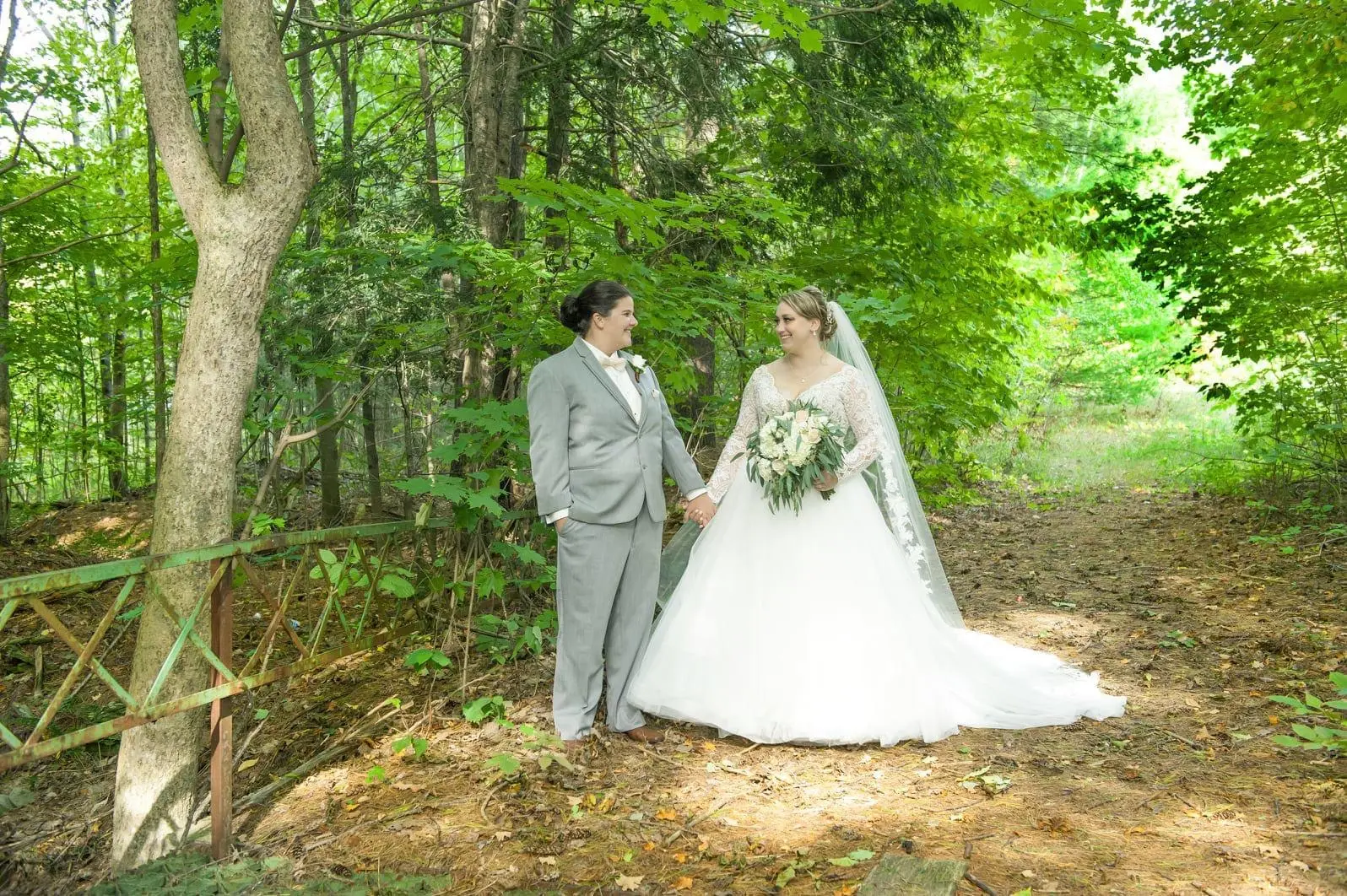 Newlyweds with Bride in Romantic Ball Gown Wedding Dress with Illusion Plunging V-Neckline Called Mallory Dawn by Maggie Sottero