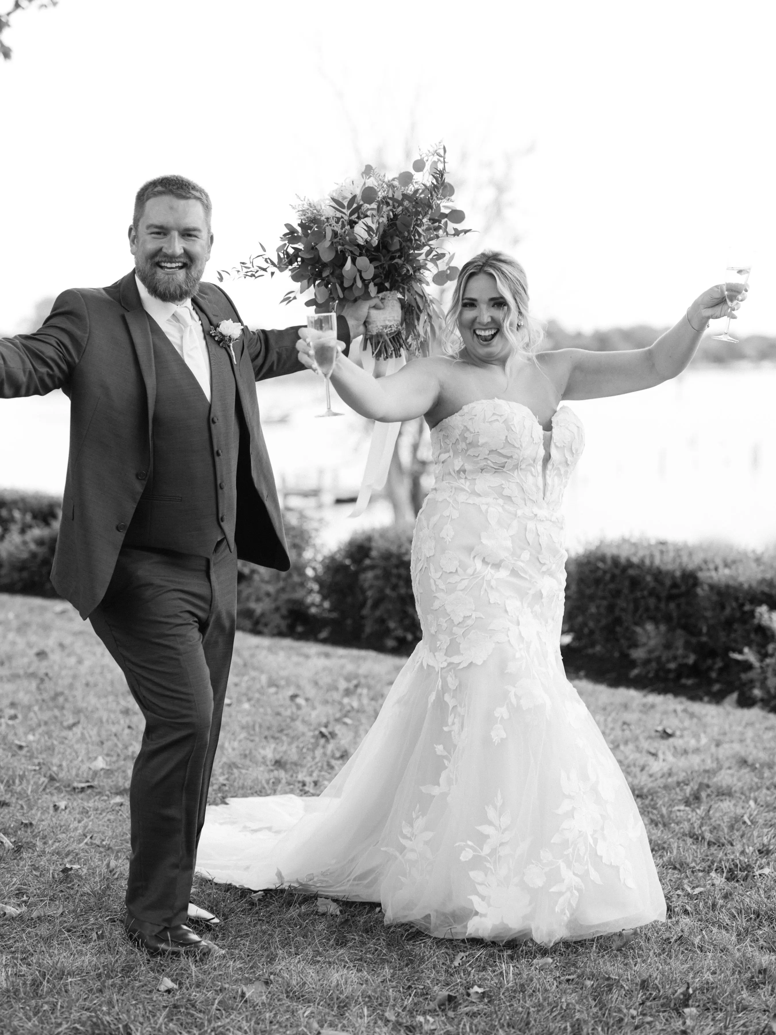 Bride Wearing Lace Mermaid Wedding Gown Called Hattie By Rebecca Ingram Cheering With Groom