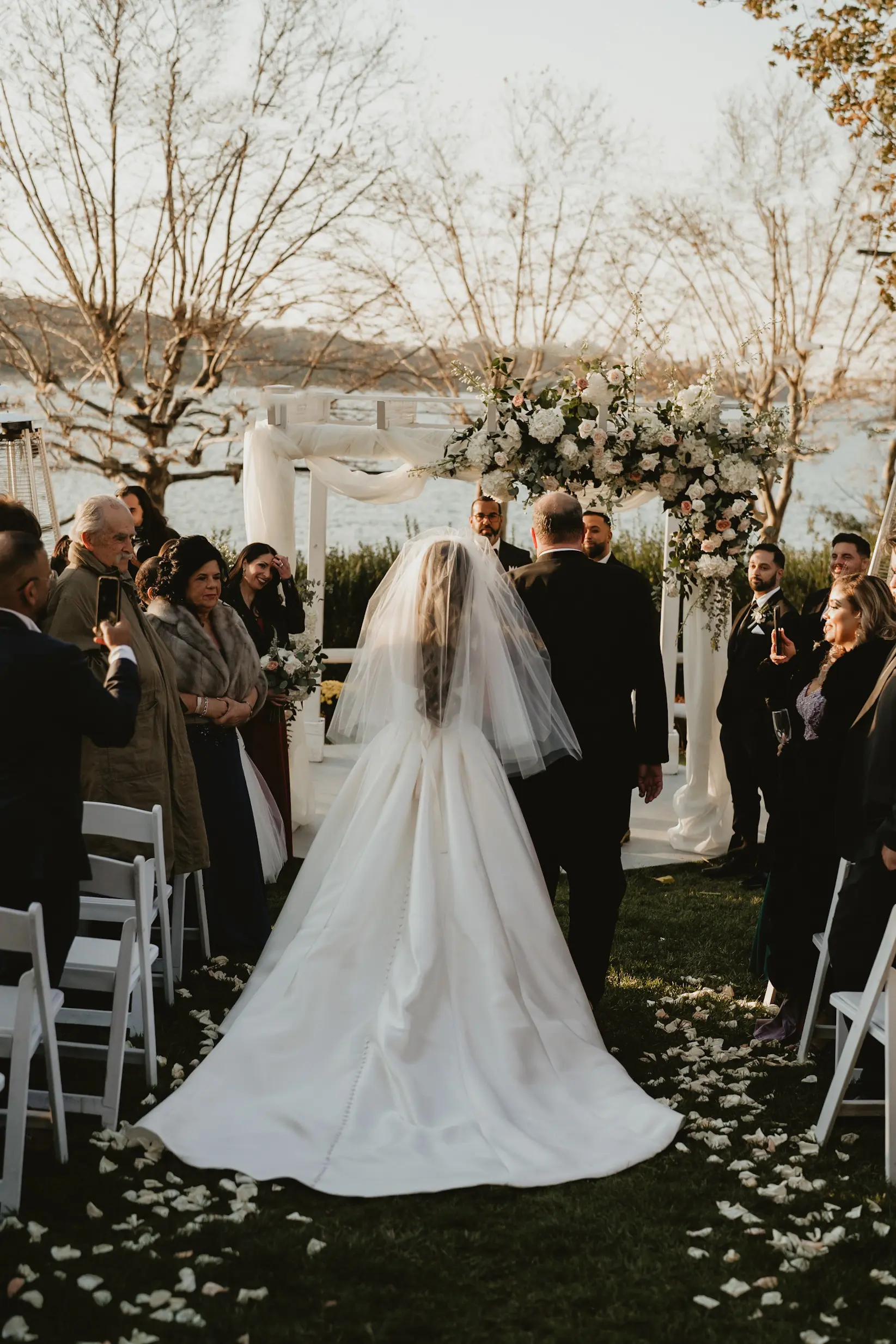 Bride In Simple Satin Wedding Dress Called Selena By Maggie Sottero Walking Down The Aisle With Mother Of The Bride