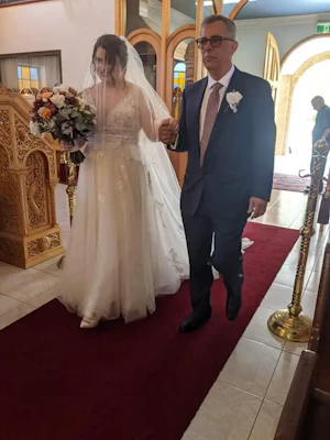Bride Walking Down the Isle in A-Line Wedding Dress Raelynn by Rebecca Ingram